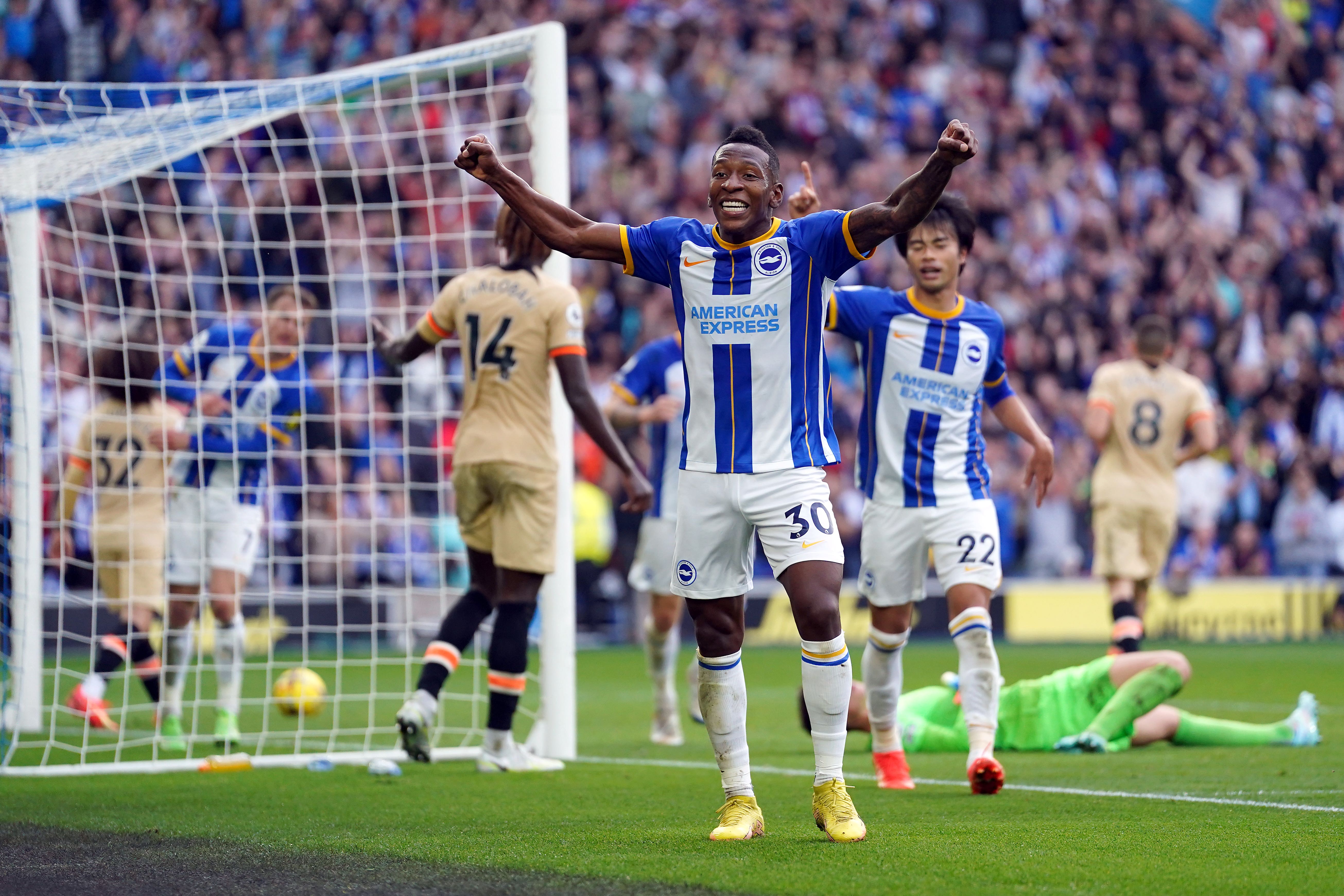 Brighton’s Pervis Estupinan celebrates after his cross was turned into his own net by Chelsea defender Trevoh Chalobah