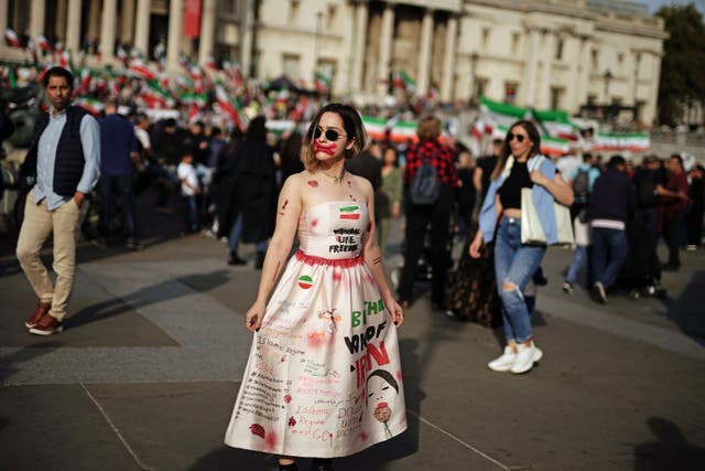 Participants take part in a demonstration in Trafalgar Square, London over the death of Iranian Mahsa Amini (PA)