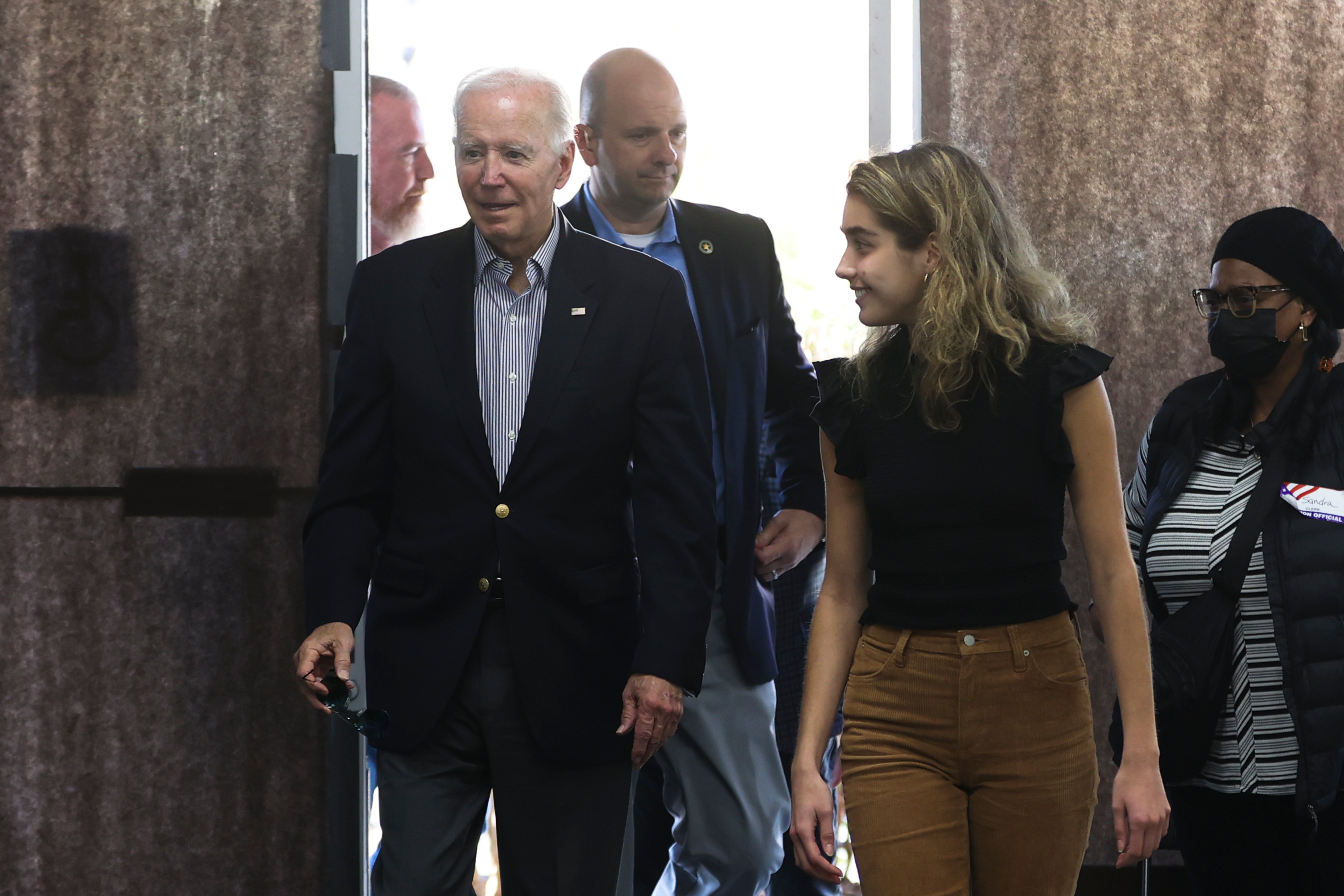 President Joe Biden arrives to cast his vote during early voting for the 2022 U.S. midterm elections with his granddaughter Natalie Biden, a first-time voter, at a polling station in Wilmington, Del., Saturday, Oct. 29, 2022. (Tasos Katopodis/Pool Photo via AP)