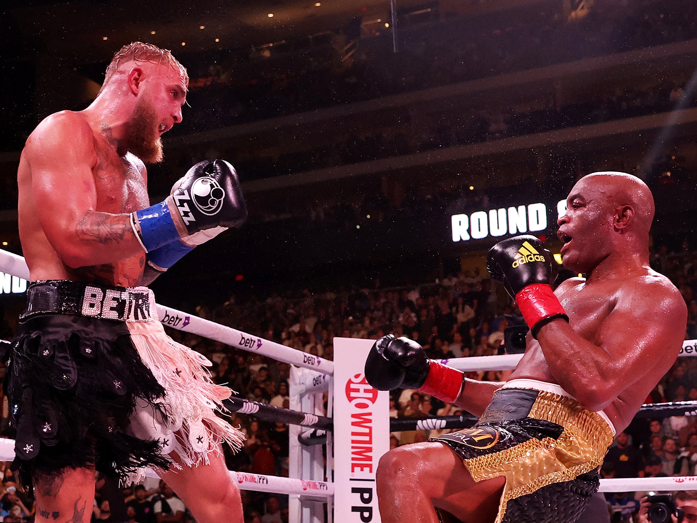 Jake Paul (left) knocked down Anderson Silva in the final round
