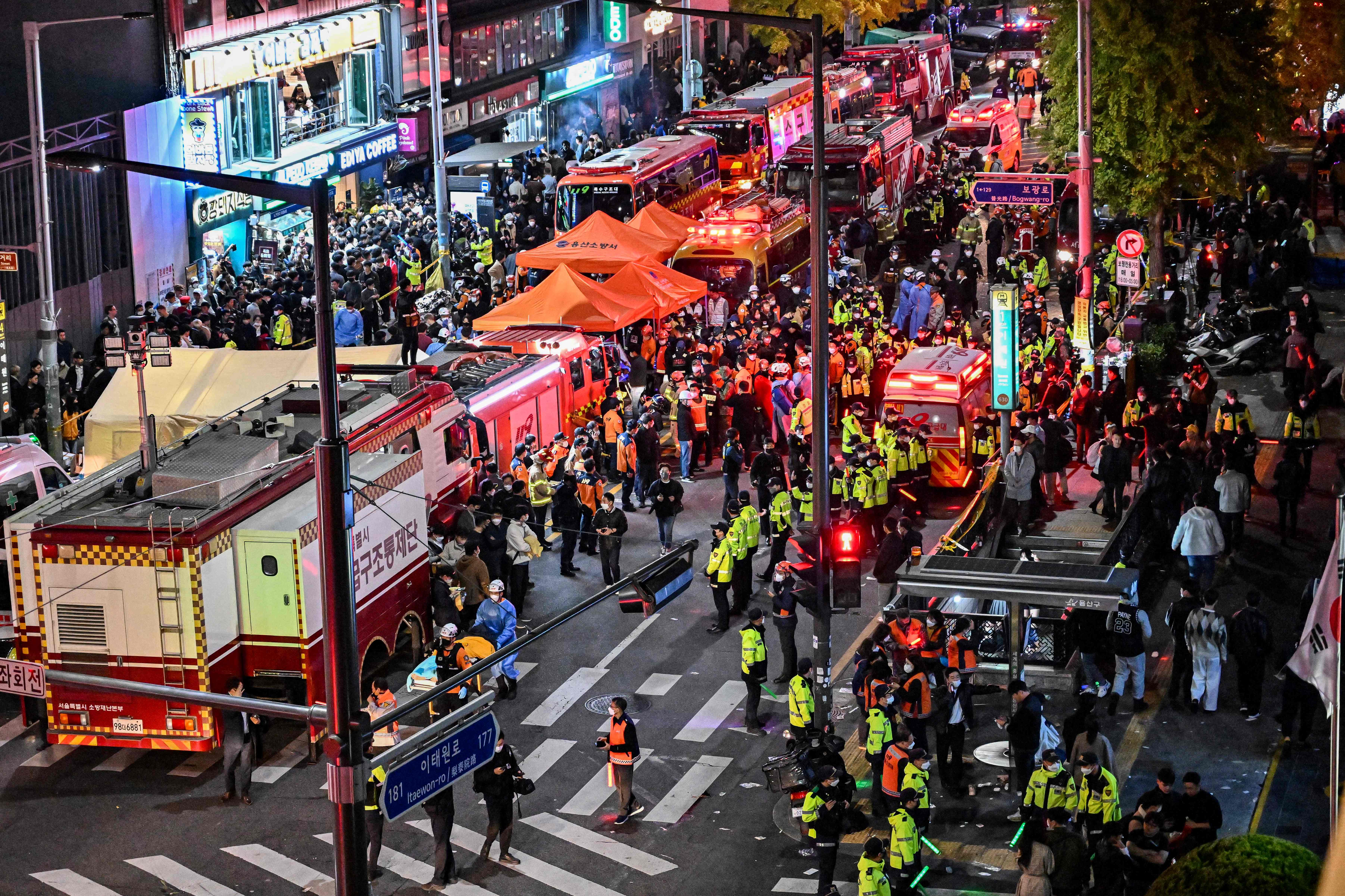 Onlookers, police and paramedics in the popular nightlife district of Itaewon