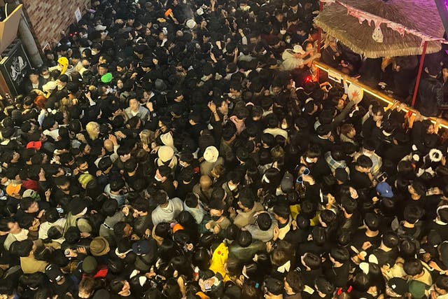 <p>A street in Itaewon district is pictured full of people before a stampede during Halloween festivities </p>