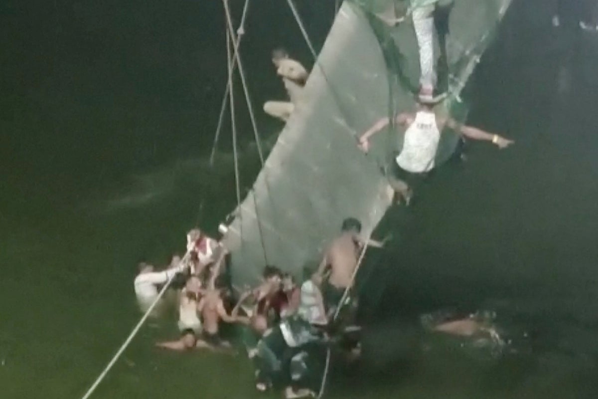 Death toll jumps to 141 after suspension bridge collapses in India ...