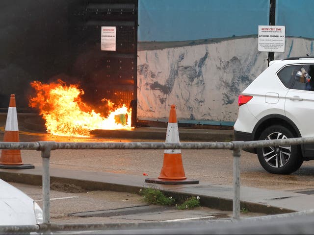 <p>A man throws “two to three” incendiary devices at a migrant centre in Dover </p>