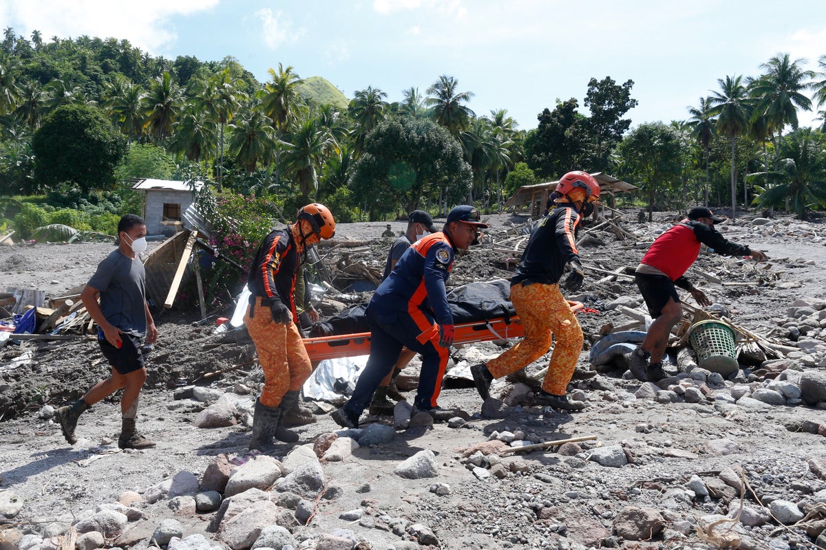 Nearly 100 dead, dozens missing in storm-ravaged Philippines