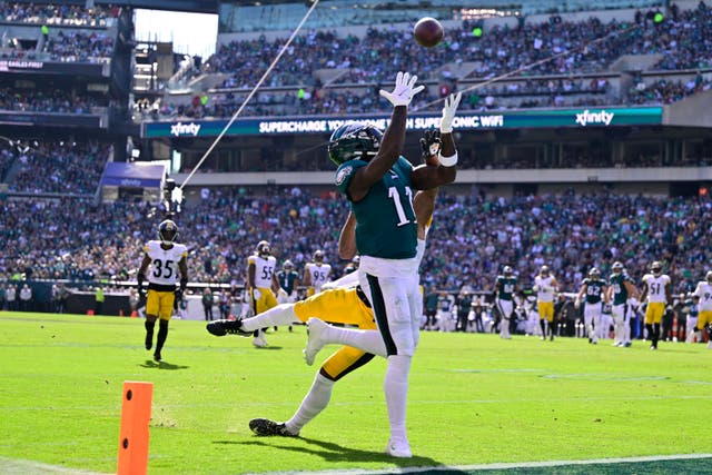 Philadelphia Eagles wide receiver AJ Brown (11) catches a touchdown pass against Pittsburgh Steelers cornerback Ahkello Witherspoon (25) (Derik Hamilton/AP)