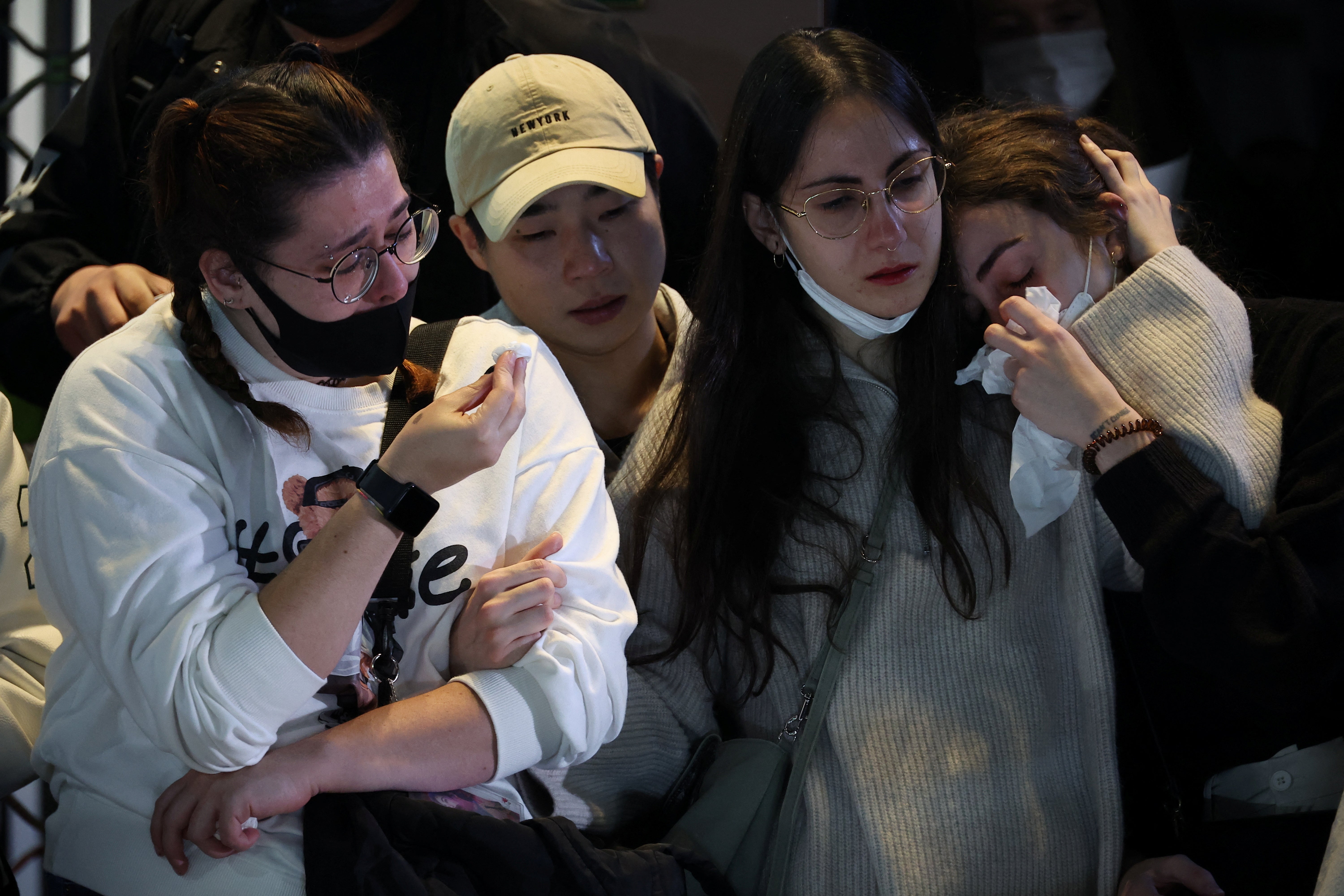 Emotions run high as people gather near the scene of the stampede