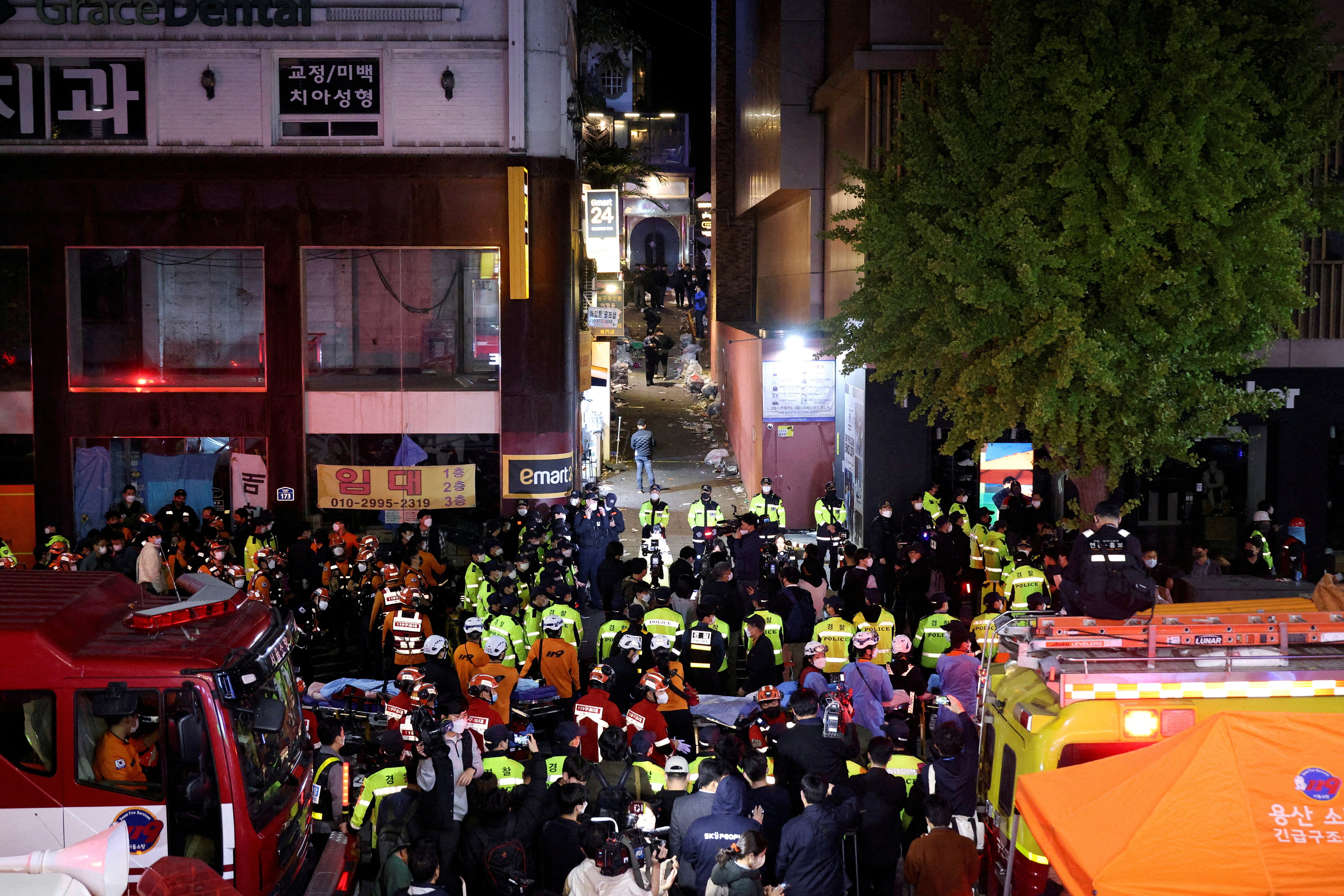 Rescue teams and firefighters work at the scene on Saturday night