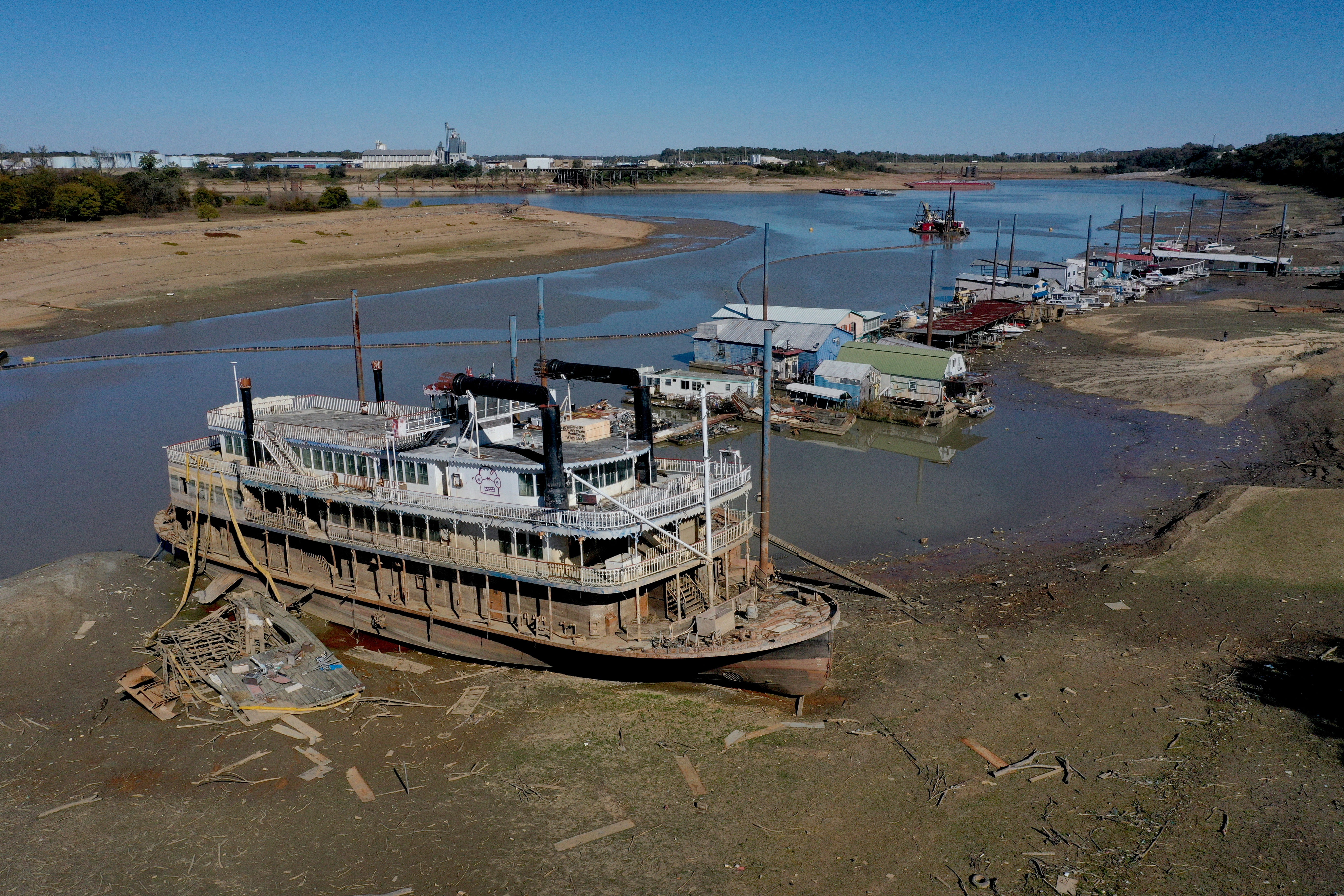 <p>The Diamond Lady, a once majestic riverboat, rests with smaller boats in mud at Riverside Park Marina along the Mississippi River on October 19, 2022 in Memphis, Tennessee</p>