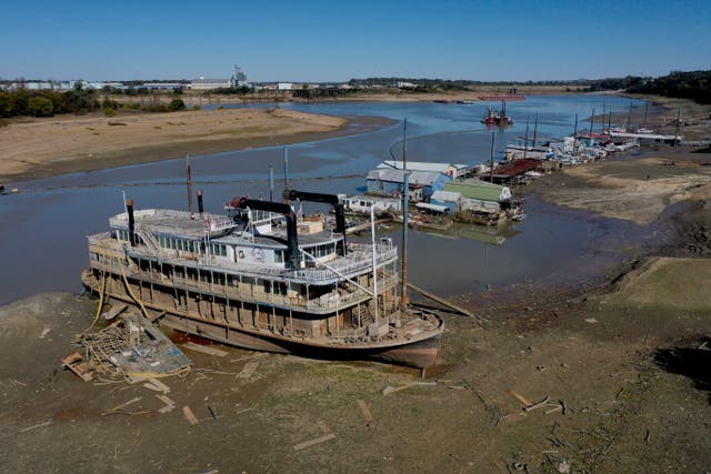 <p>The Diamond Lady, a once majestic riverboat, rests with smaller boats in mud at Riverside Park Marina along the Mississippi River on October 19, 2022 in Memphis, Tennessee</p>