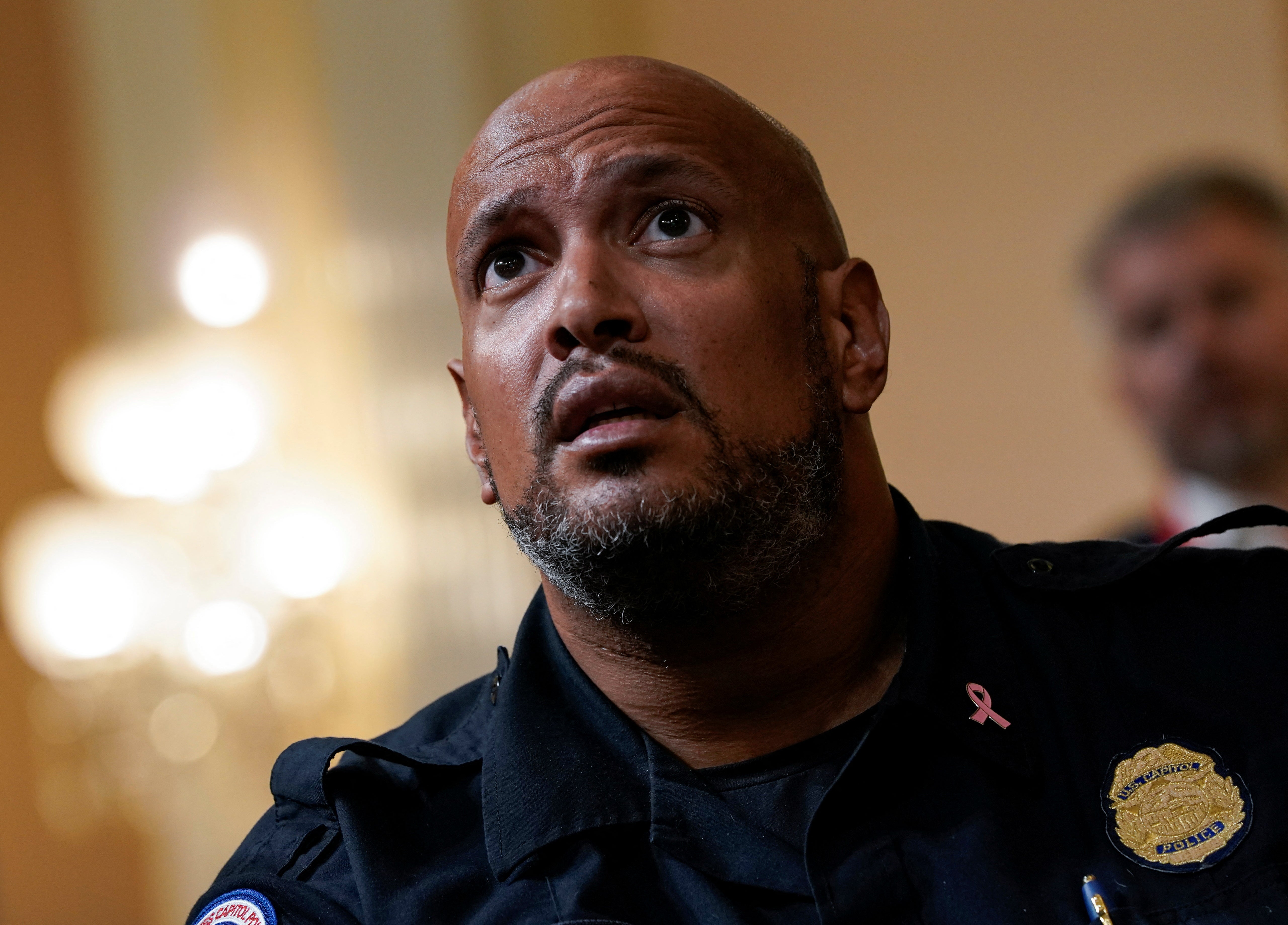 Then police officer Harry Dunn watches a video of the January 6, 2021 riots during the House Select Committee investigation into the violence in 2022.