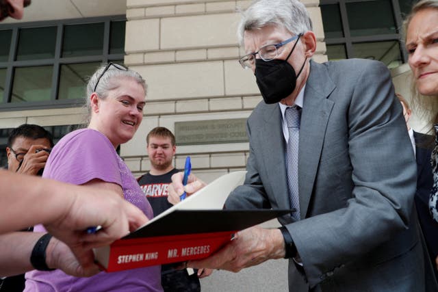<p>Author Stephen King leaves federal court after testifying for the Department of Justice as it bids to block the proposed merger in August this year </p>