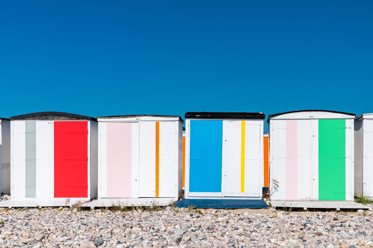 Bright beach huts on Le Havre’s pebble beach