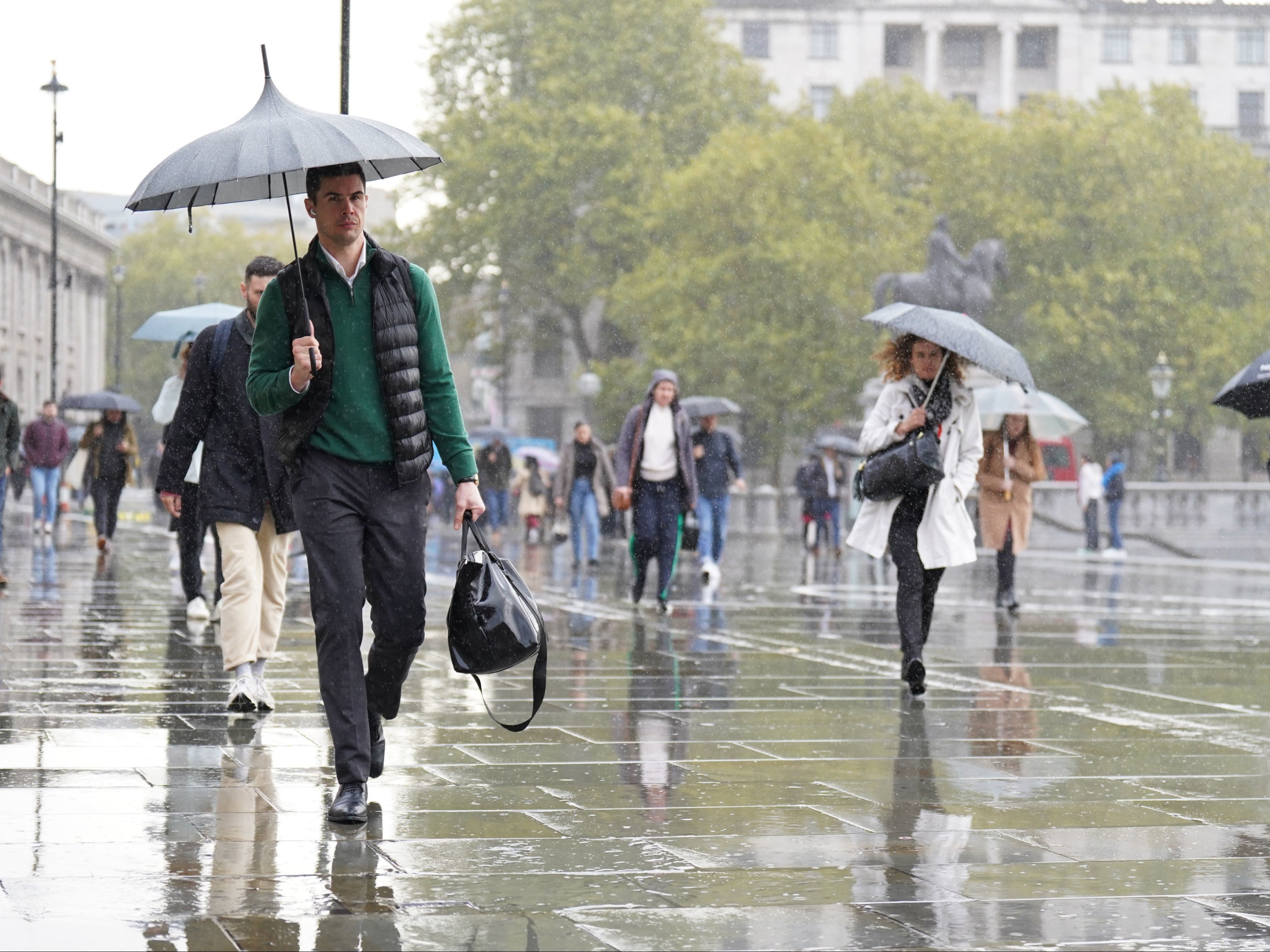 Commuters battled through the weather at Trafalgar Square