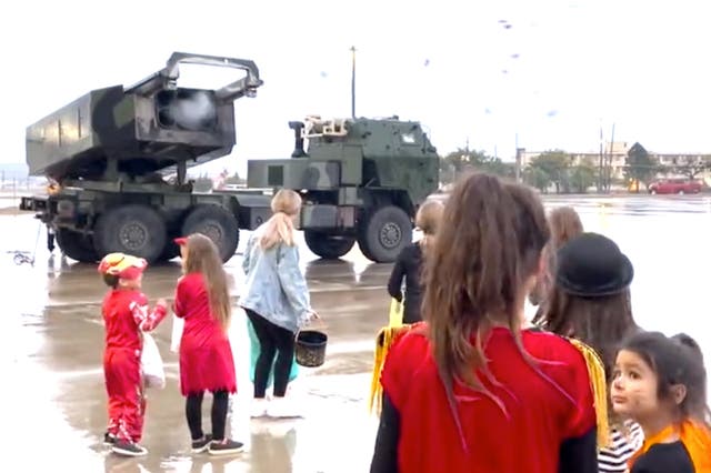 <p>A High Mobility Artillery Rocket System (HIMARS) shoots out candy for children on Halloween</p>