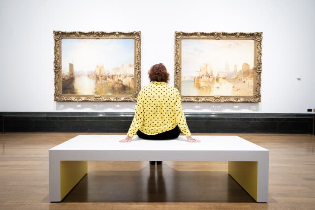 A woman views the press view for the Turner on Tour exhibition at the National Gallery, London (James Manning/PA)