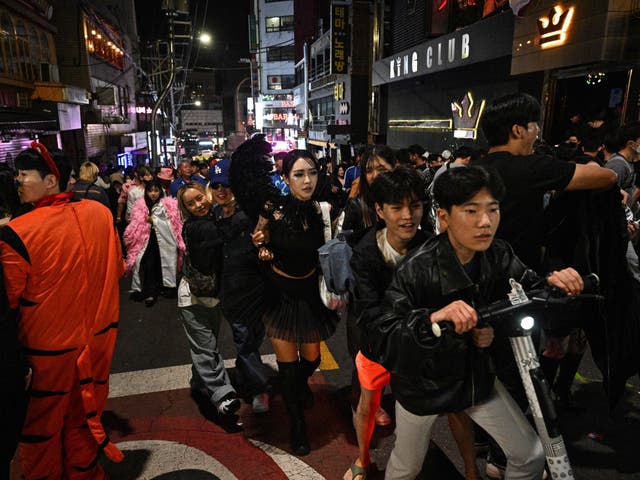 <p>Revellers gather in the neighbourhood of Itaewon in Seoul near where the stampede took place</p>