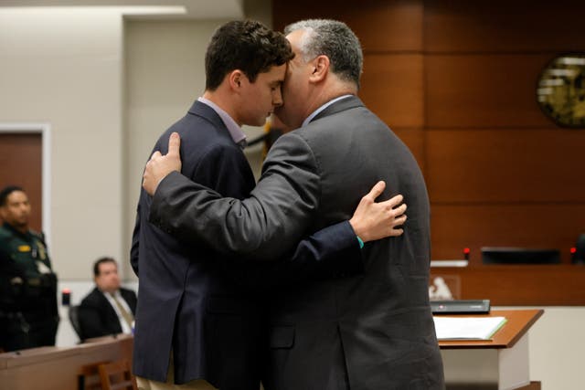 <p>Tony Montalto embraces his son Anthony, after Anthony gave his victim impact statement about the murder of his sister Gina </p>