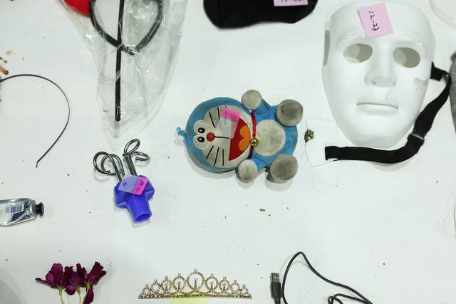 <p>Belongings of the victims are photographed at a gym, where belongings of the victims of a crowd crush that happened during Halloween festivities were recovered </p>