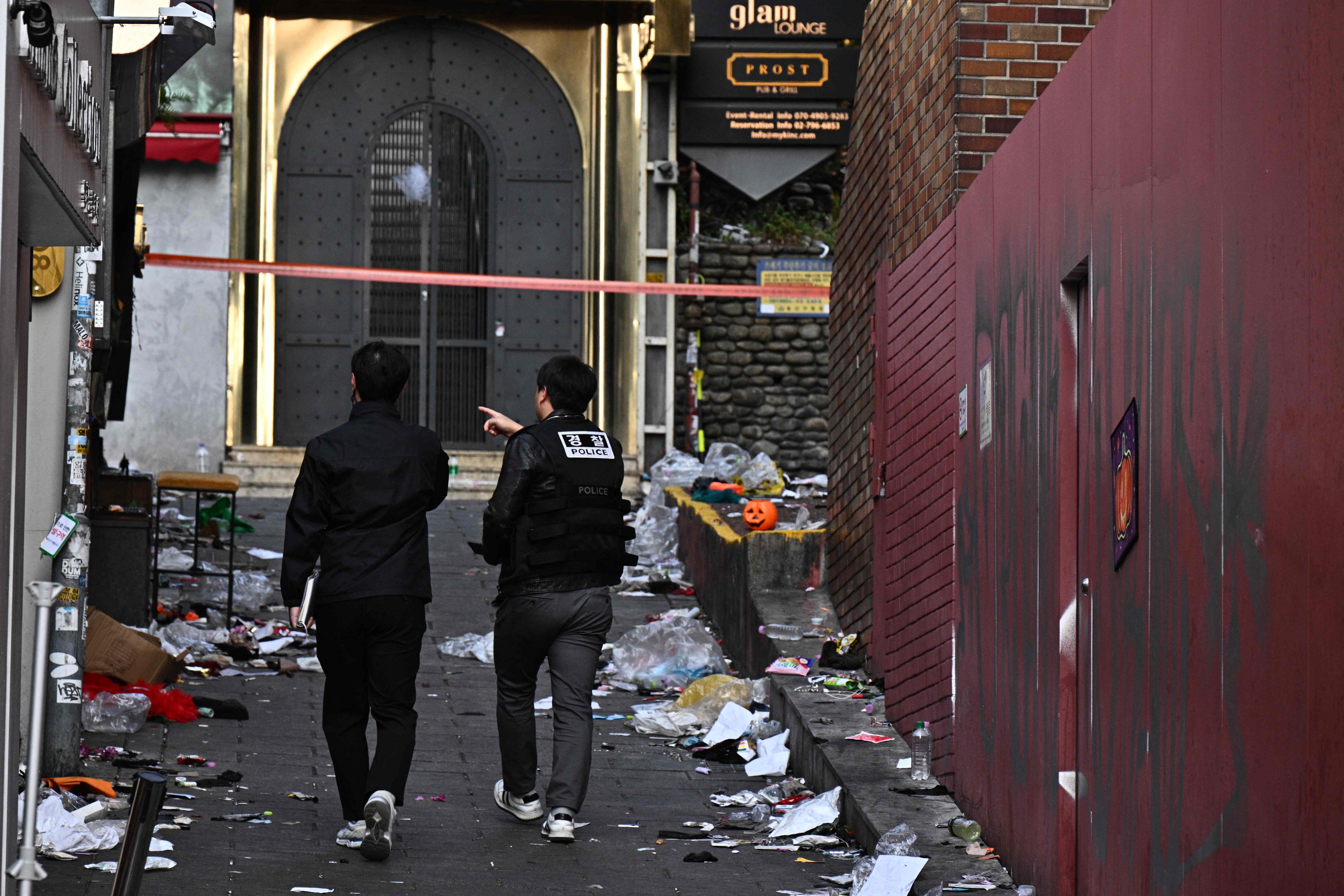 Police visit the cordoned scene two days after a deadly Halloween crush in the district of Itaewon in Seoul