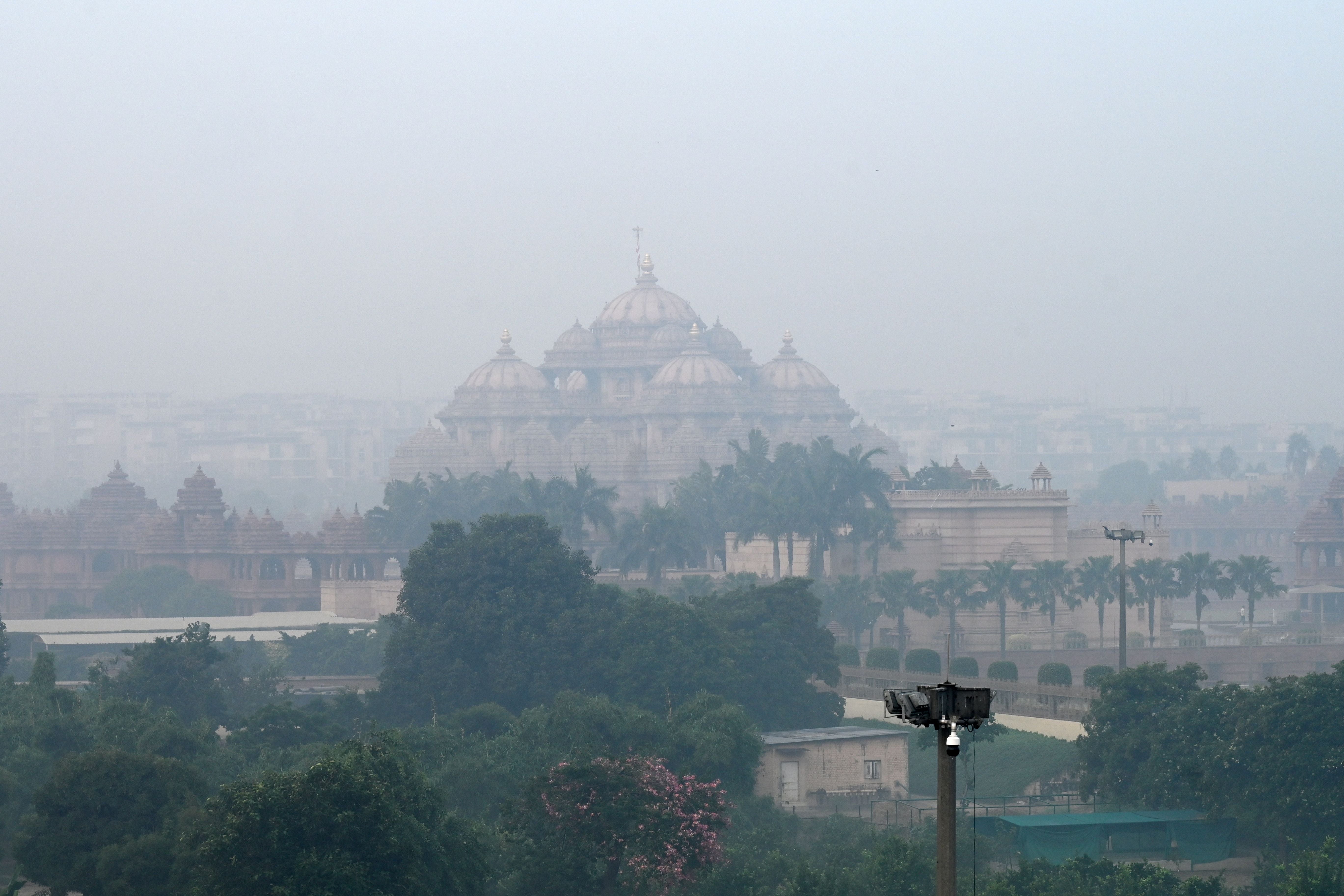 A general view of the Akshardham temple is pictured amid smoggy conditions in New Delhi on Tuesday