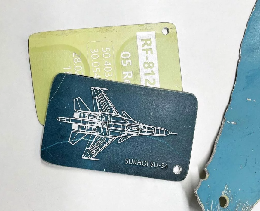 A luggage tag made from scrap retrieved from a downed Russian fighter plane