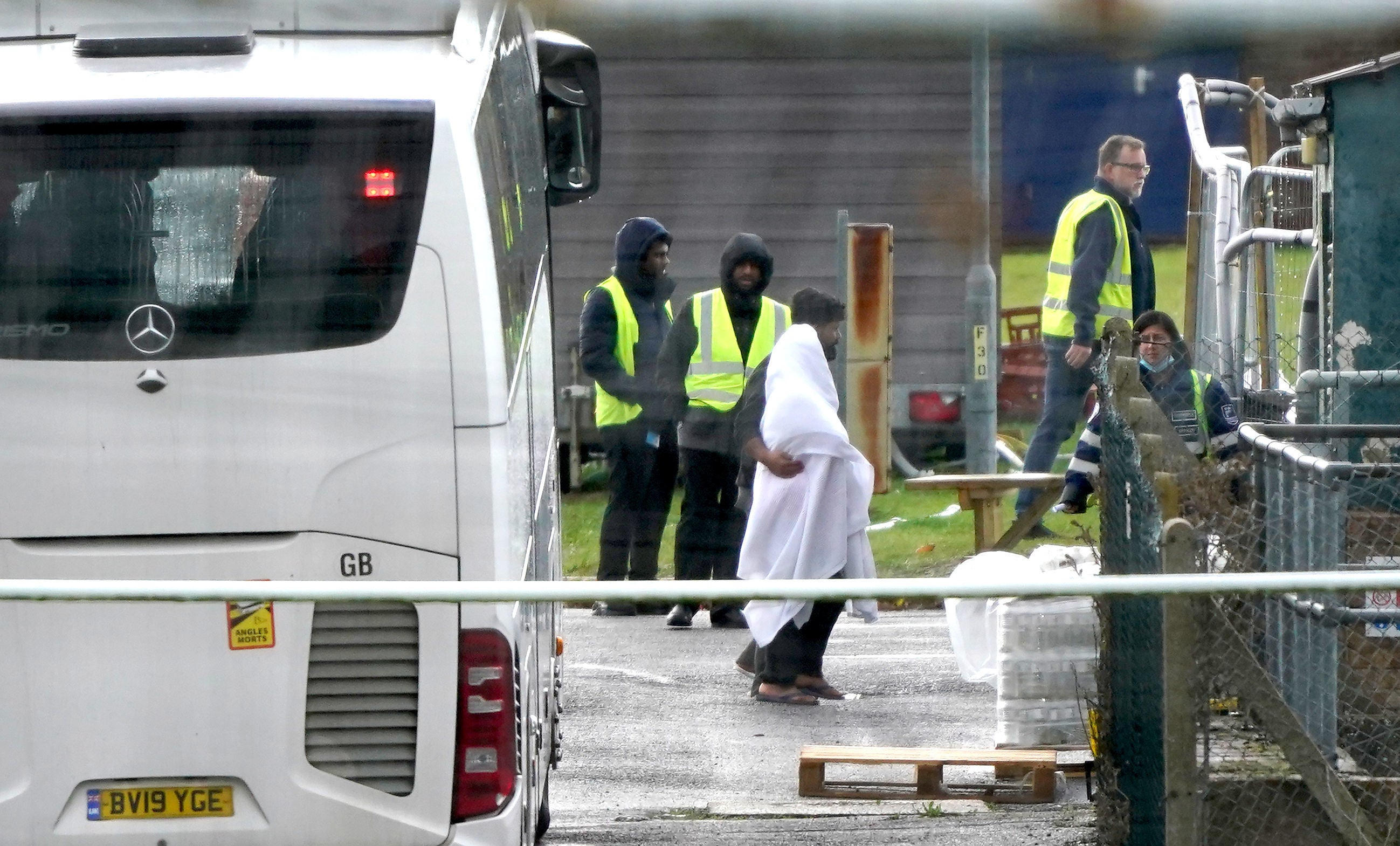 People thought to be migrants at the Manston immigration short-term holding facility