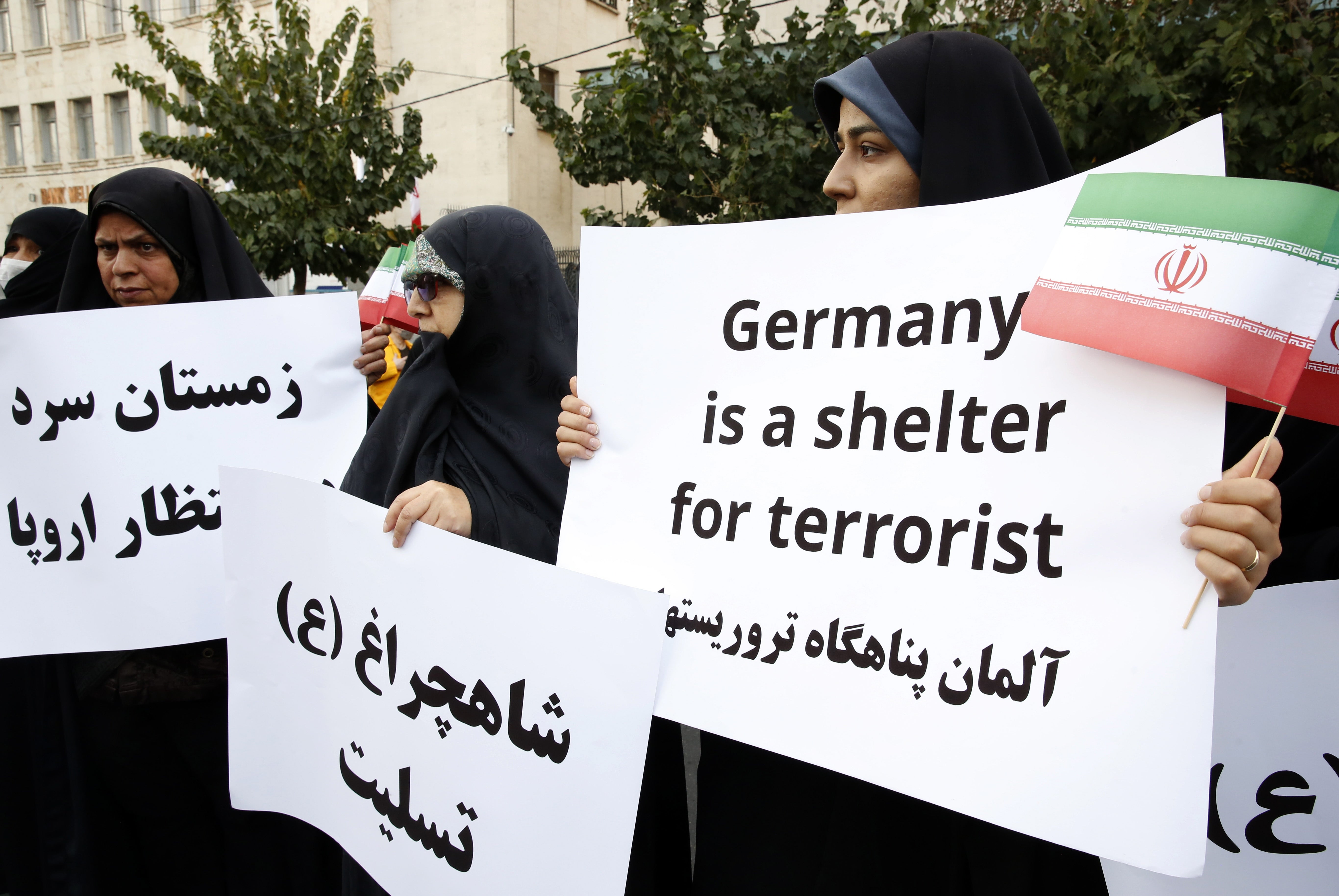 Iranians take part during an anti-Germany protest in front of the German embassy in Tehran on Tuesday