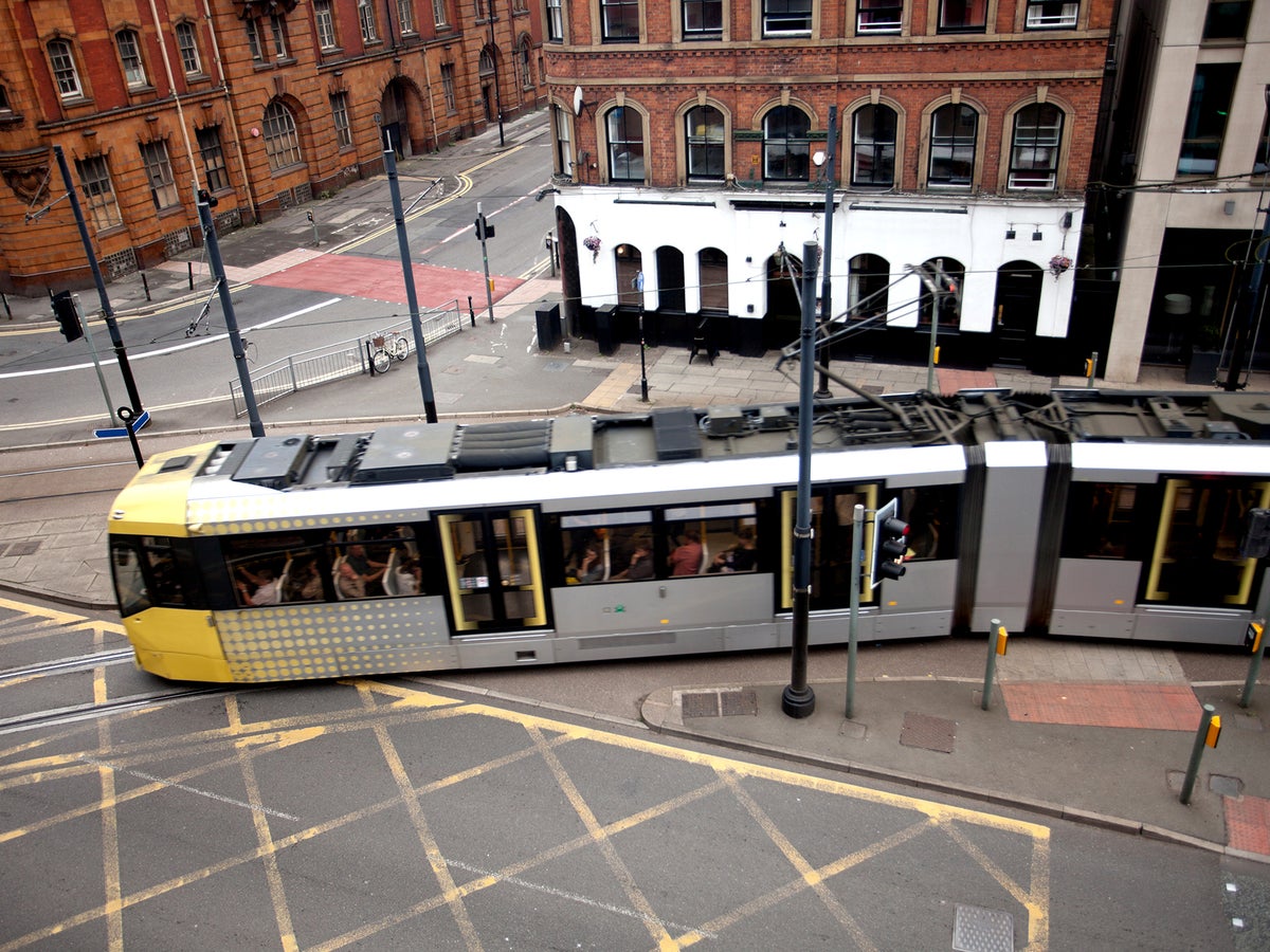 Four injured as tram and car collide in Manchester
