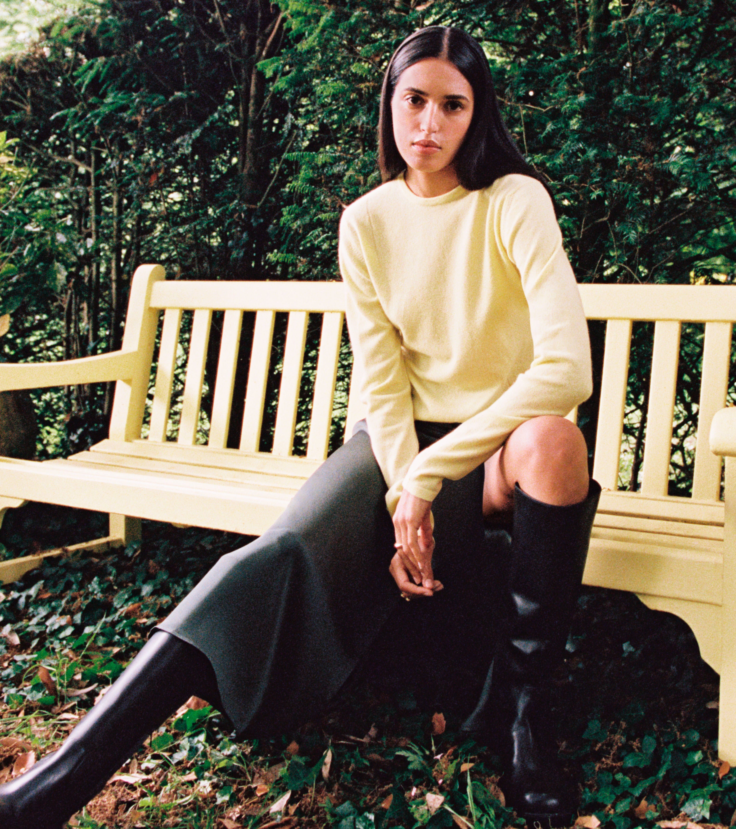 Photo issued by Yoox Net-A-Porter of a yellow cashmere jumper matching the benches at Highgrove being modelled at Highgrove House, Tetbury, Gloucestershire