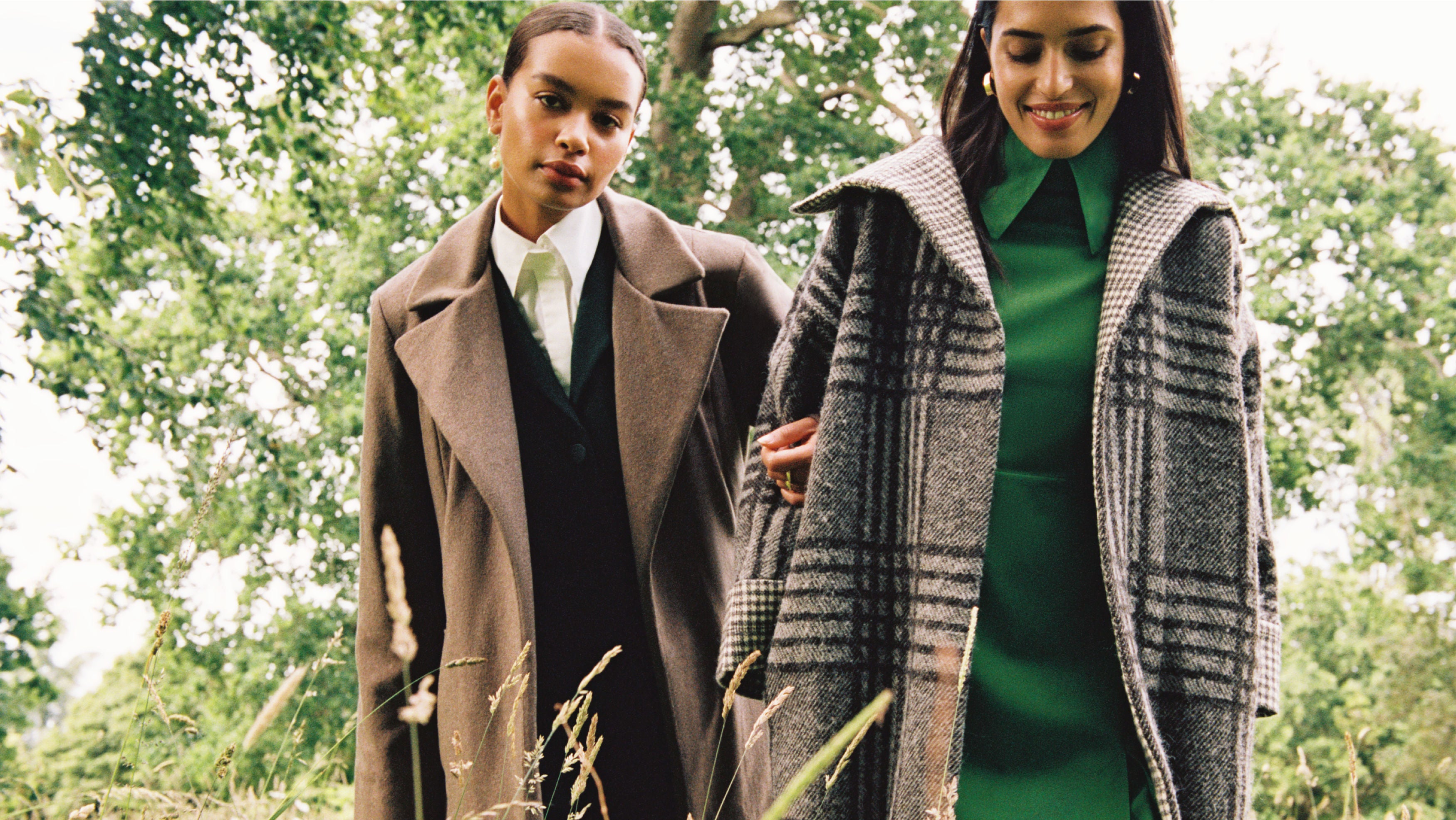 Photo issued by Yoox Net-A-Porter of a cashmere coat (left) and a check coat being modelled at Highgrove House