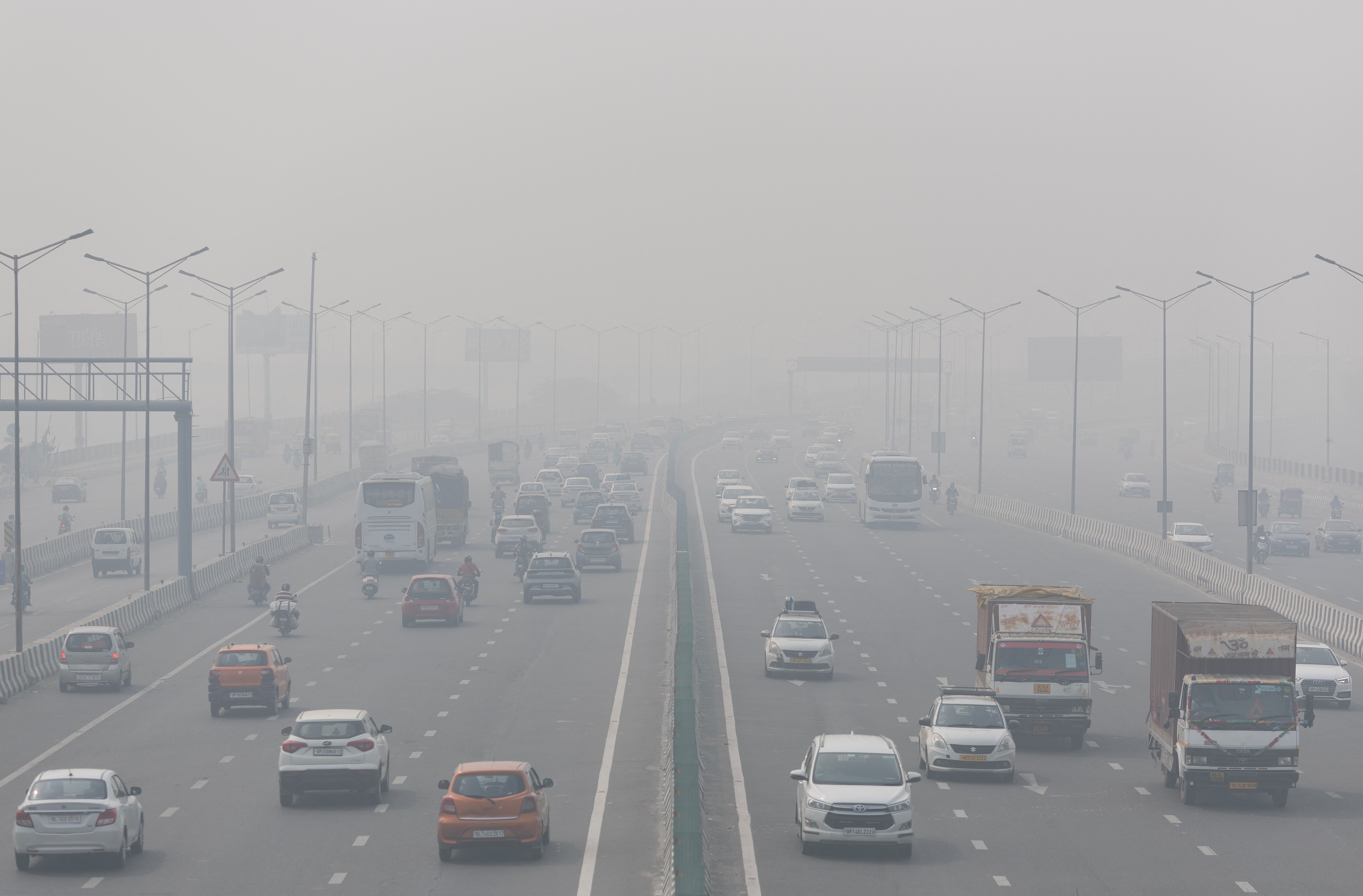 A highway shrouded in heavy smog in New Delhi, India, on Thursday