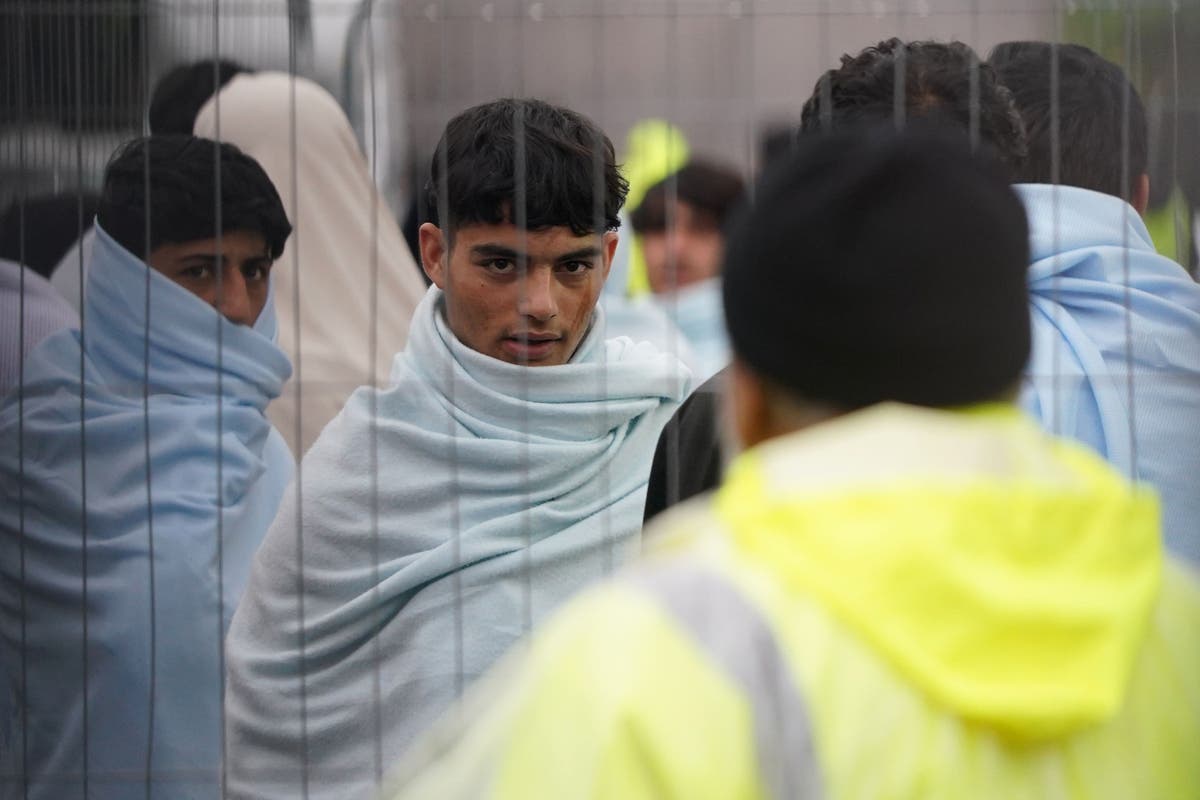 Embattled Home Secretary visits migrant centres in bid to grip crisis