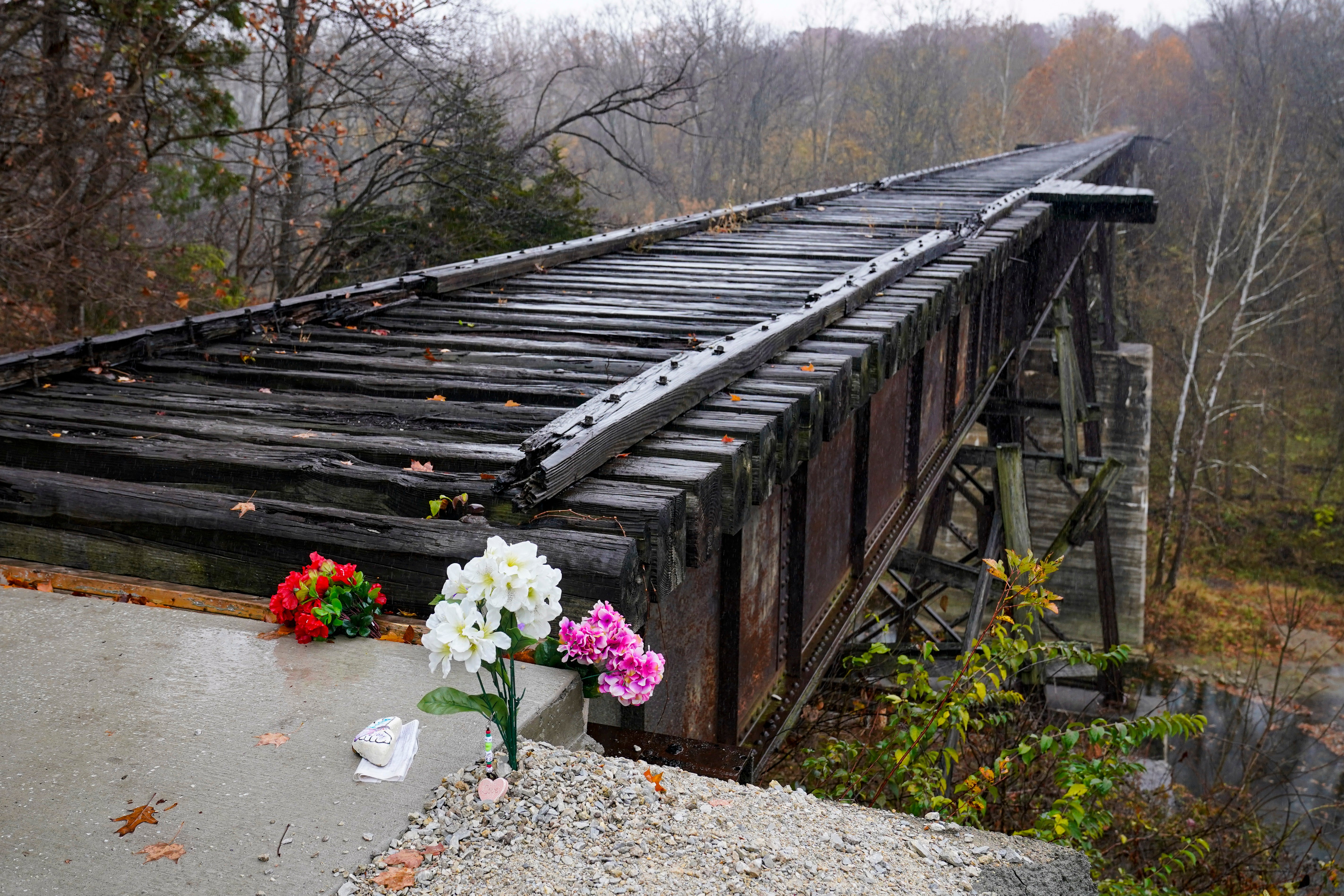 Flowers at the Monon High Bridge in memory of Libby and Abby