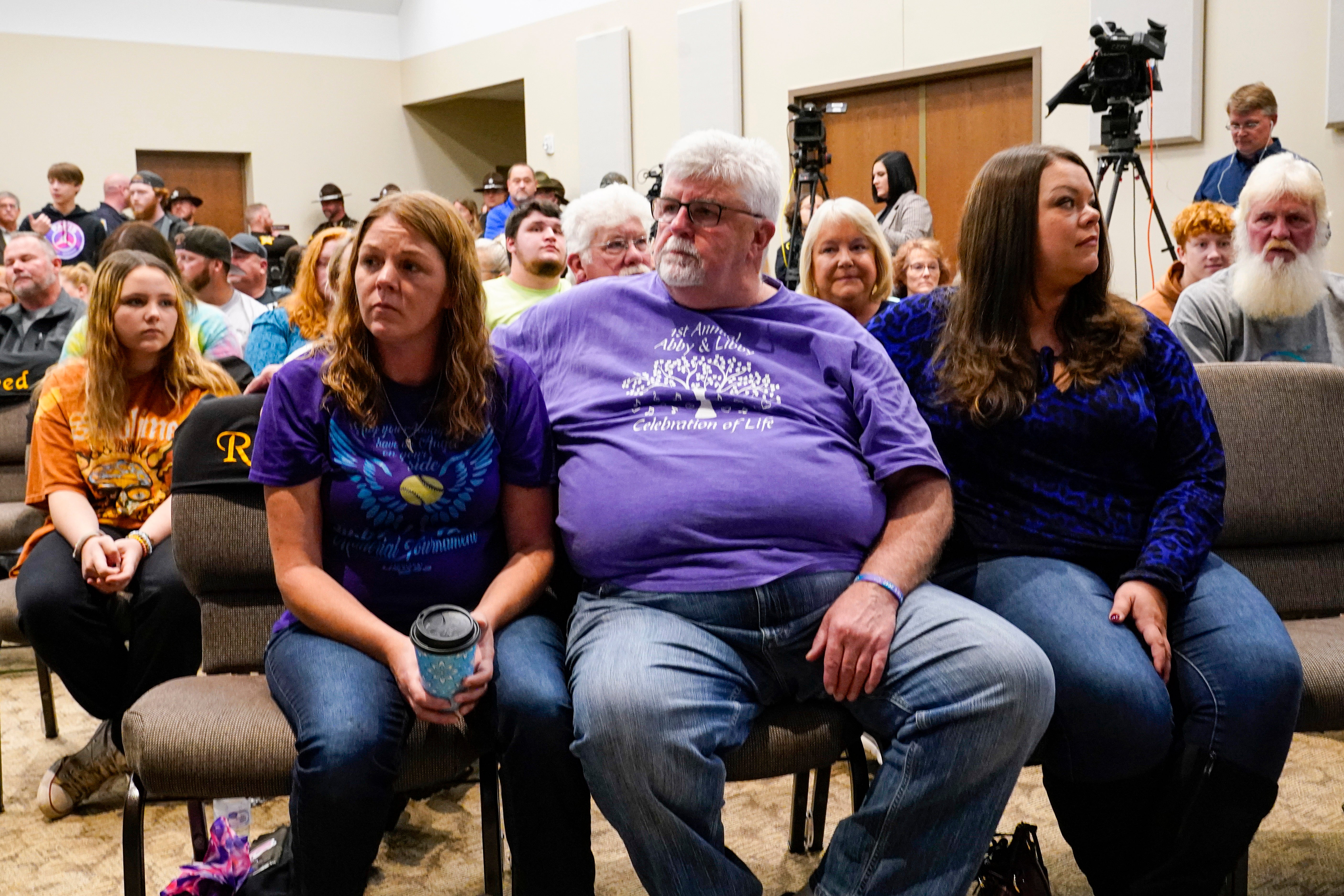 Family members of Liberty German, and Abigail Williams listen as Indiana State Police Superintendent Doug Carter announce arrest