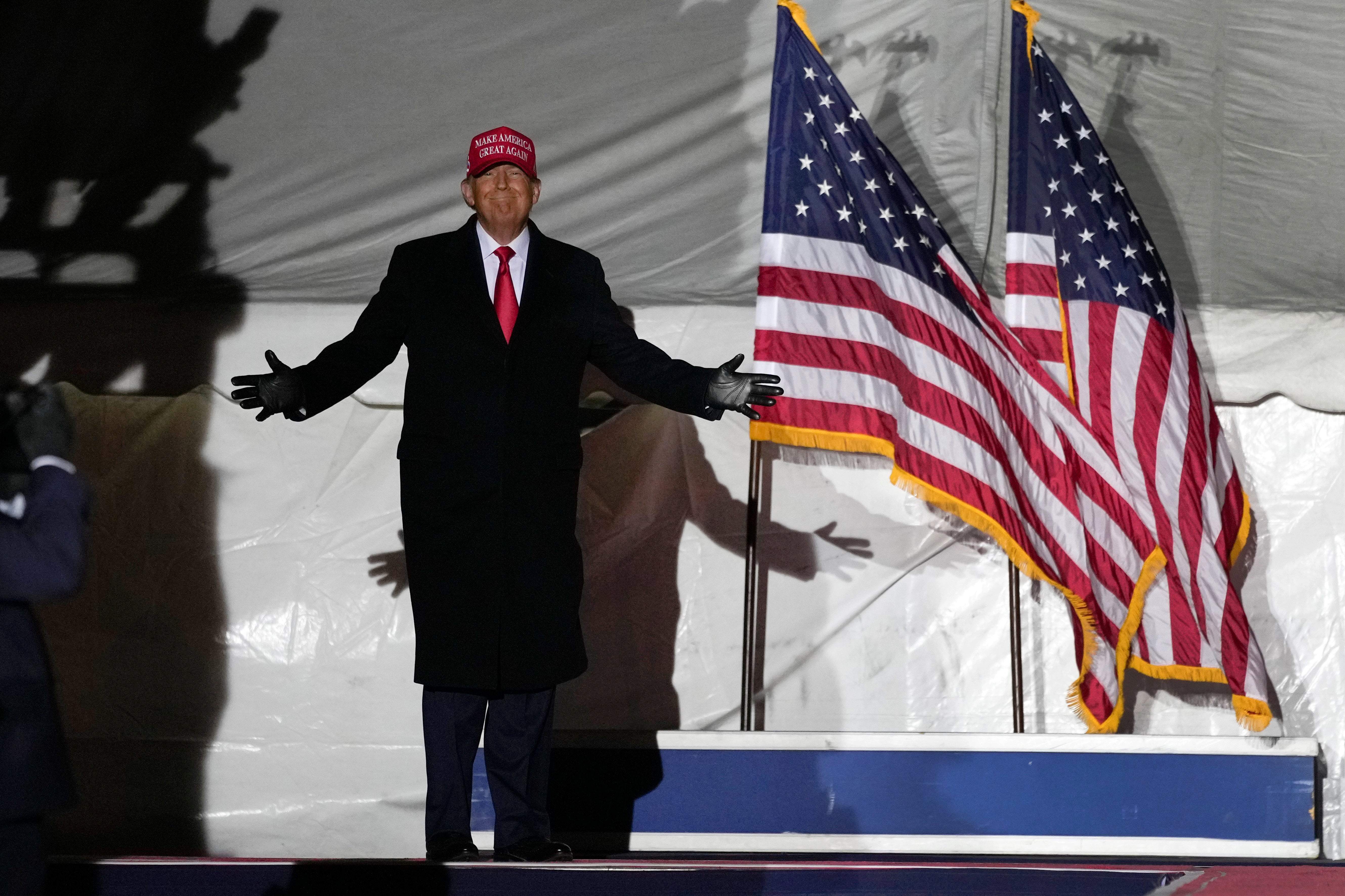 Former President Donald Trump arrives to speak at a rally in Sioux City, Iowa, on Thursday