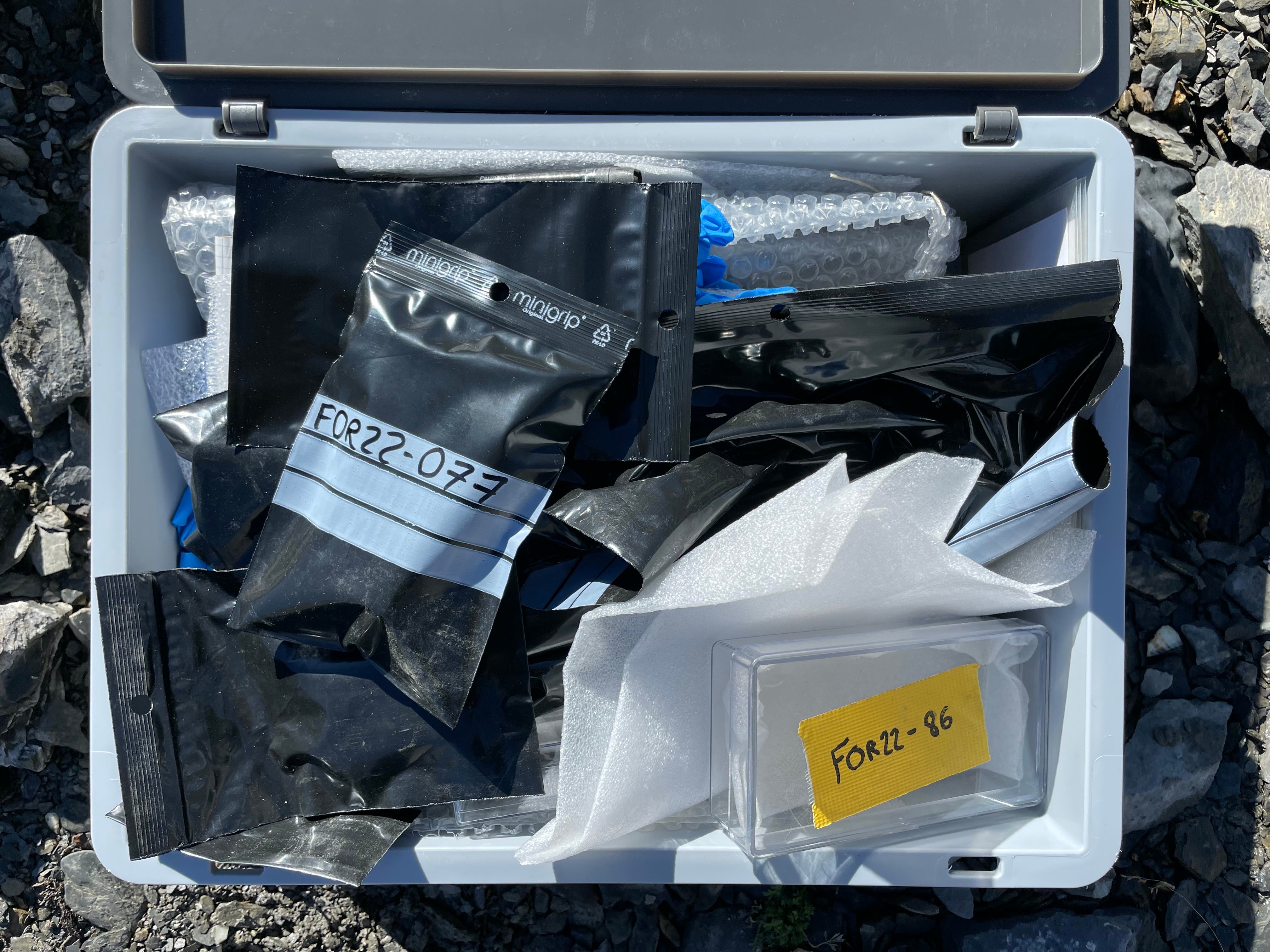 Artefacts found by archaeologists in the melting ice of the Forcle Glacier, bagged and labelled