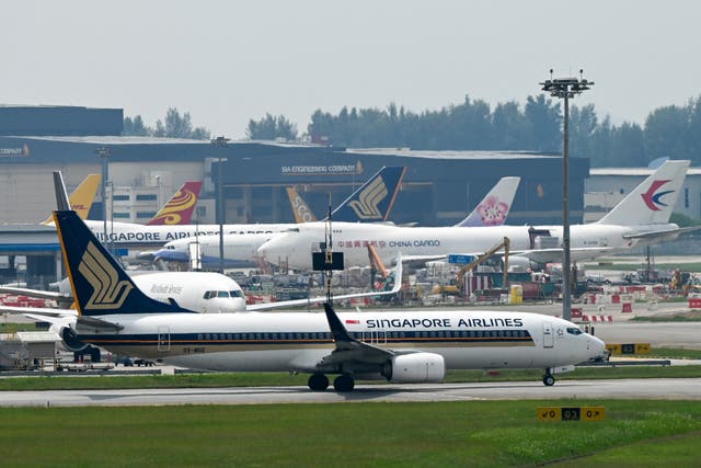 <p>File photo: A Singapore Airlines plane plies along the tarmac of Singapore Changi Airport in Singapore</p>