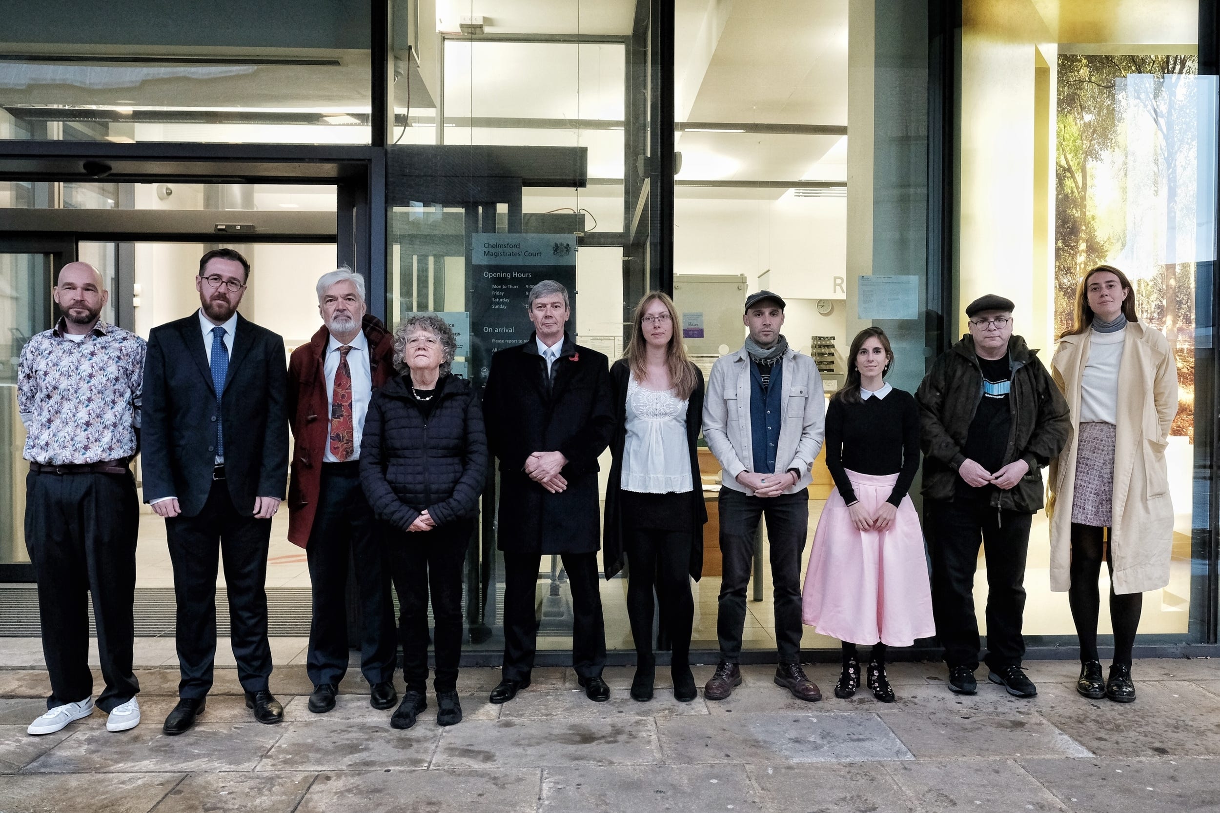 Greenpeace activists (left to right) Ben Hearne-Salter, Henry Rayner, David James, Lyndall Stein, Mike Grant, Kim Harrison, Benji Bailes, Zoe Pontida, Ian Mills and Rhiannon Wood outside Chelmsford Magistrates’ Court (Angela Christofilou/Greenpeace/PA)