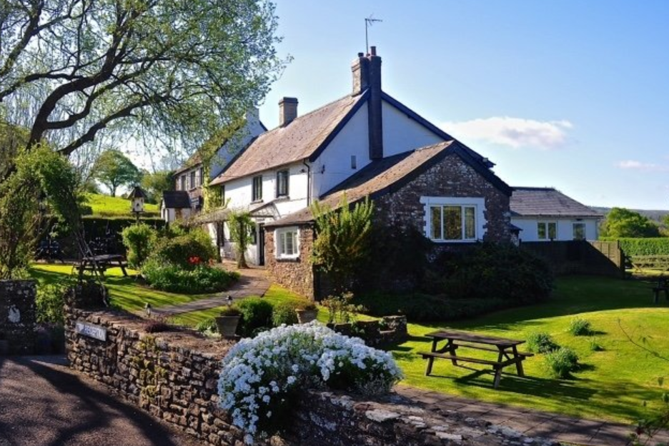 A welcoming inn with roaring fires for winter and flowery gardens for summer