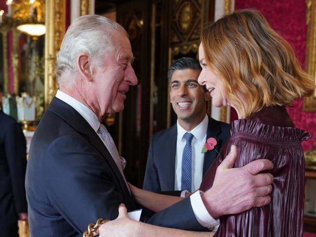 <p>King Charles greets Rishi Sunak and Stella McCartney  at a reception for world leaders</p>