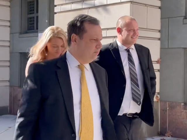 <p>Troy Faulkner walks outside a DC courthouse after being sentenced to five months in prison</p>