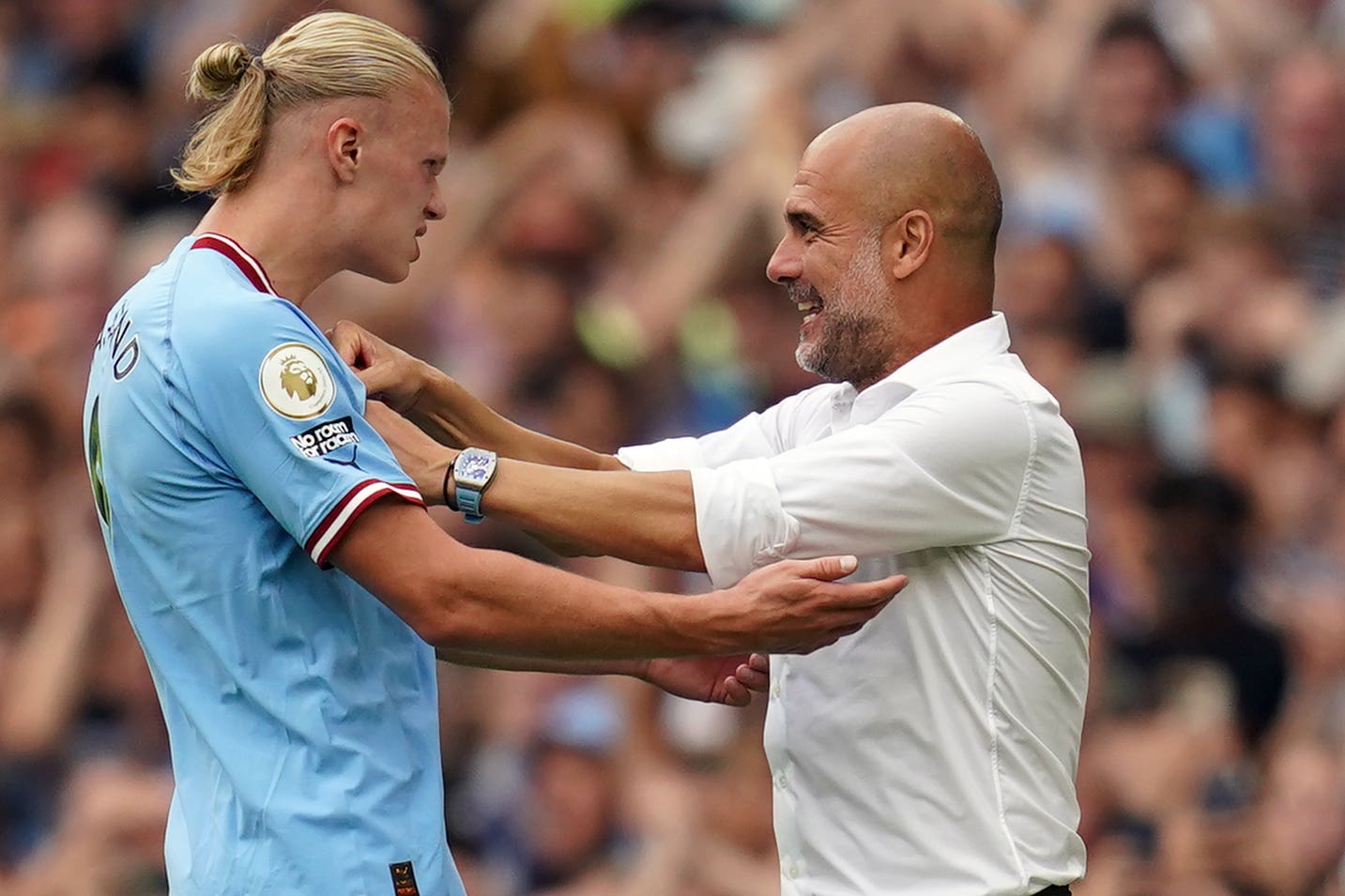 Pep Guardiola (right) has joked he is jealous of Erling Haaland’s profile (Nick Potts/PA)