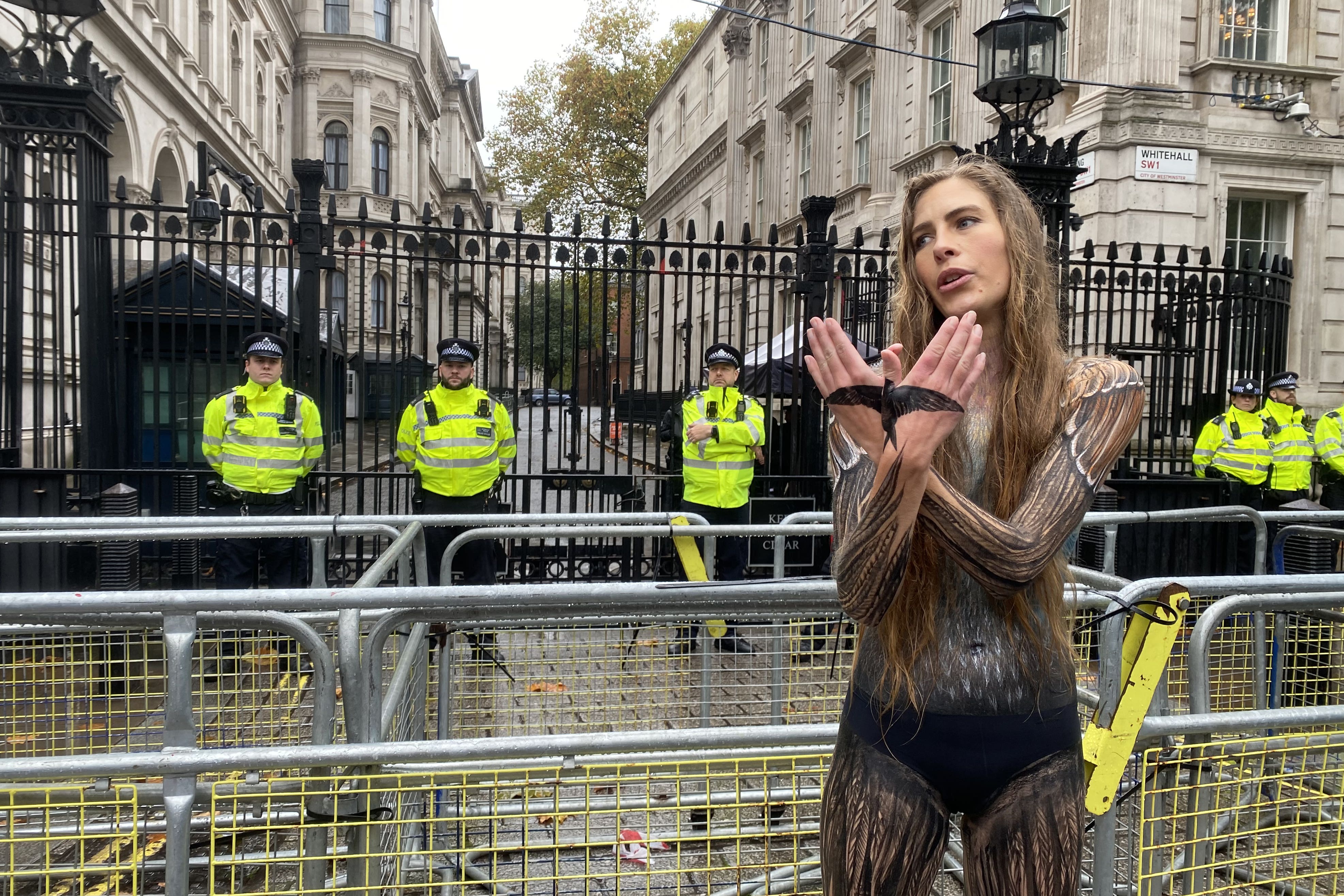 Activist Marches Through London In Almost Nothing But Paint In Bid To Activist Marches Through London In Almost Nothing But Paint In Bid To