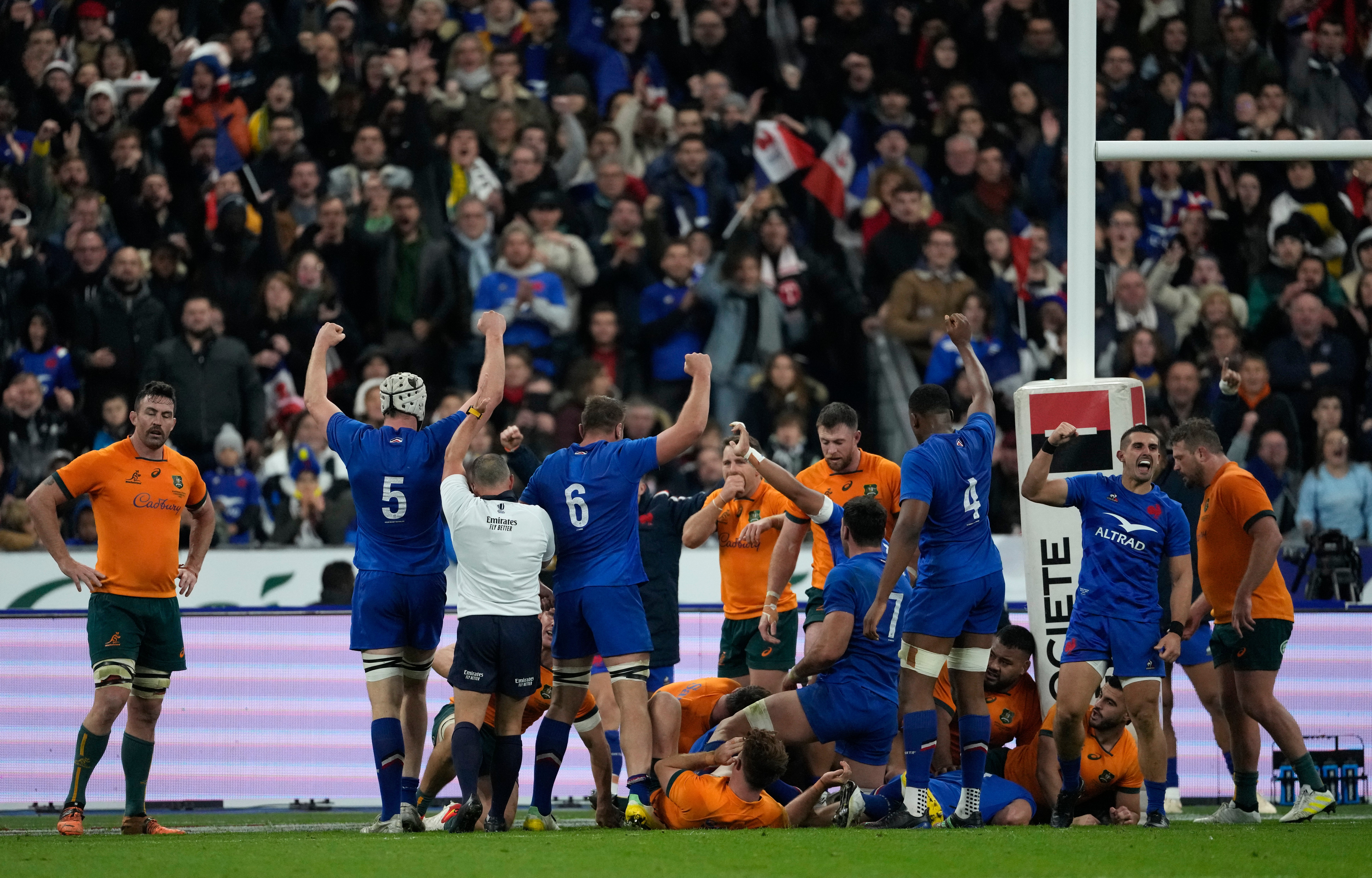 French players celebrate after scoring their first try