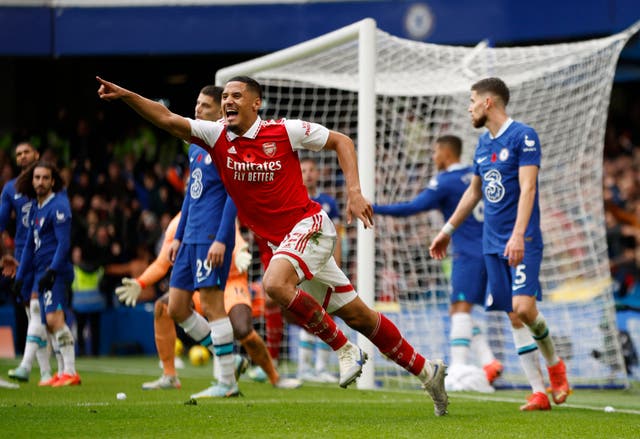 <p>William Saliba celebrates after his central defensive partner Gabriel scored to give the Gunners victory at Stamford Bridge </p>