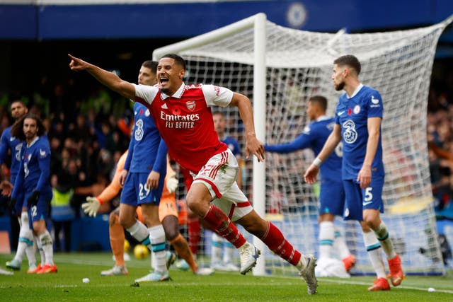 <p>William Saliba celebrates after his central defensive partner Gabriel scored to give the Gunners victory at Stamford Bridge </p>