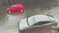 Roads in London submerged by flooding as Met Office issues another warning