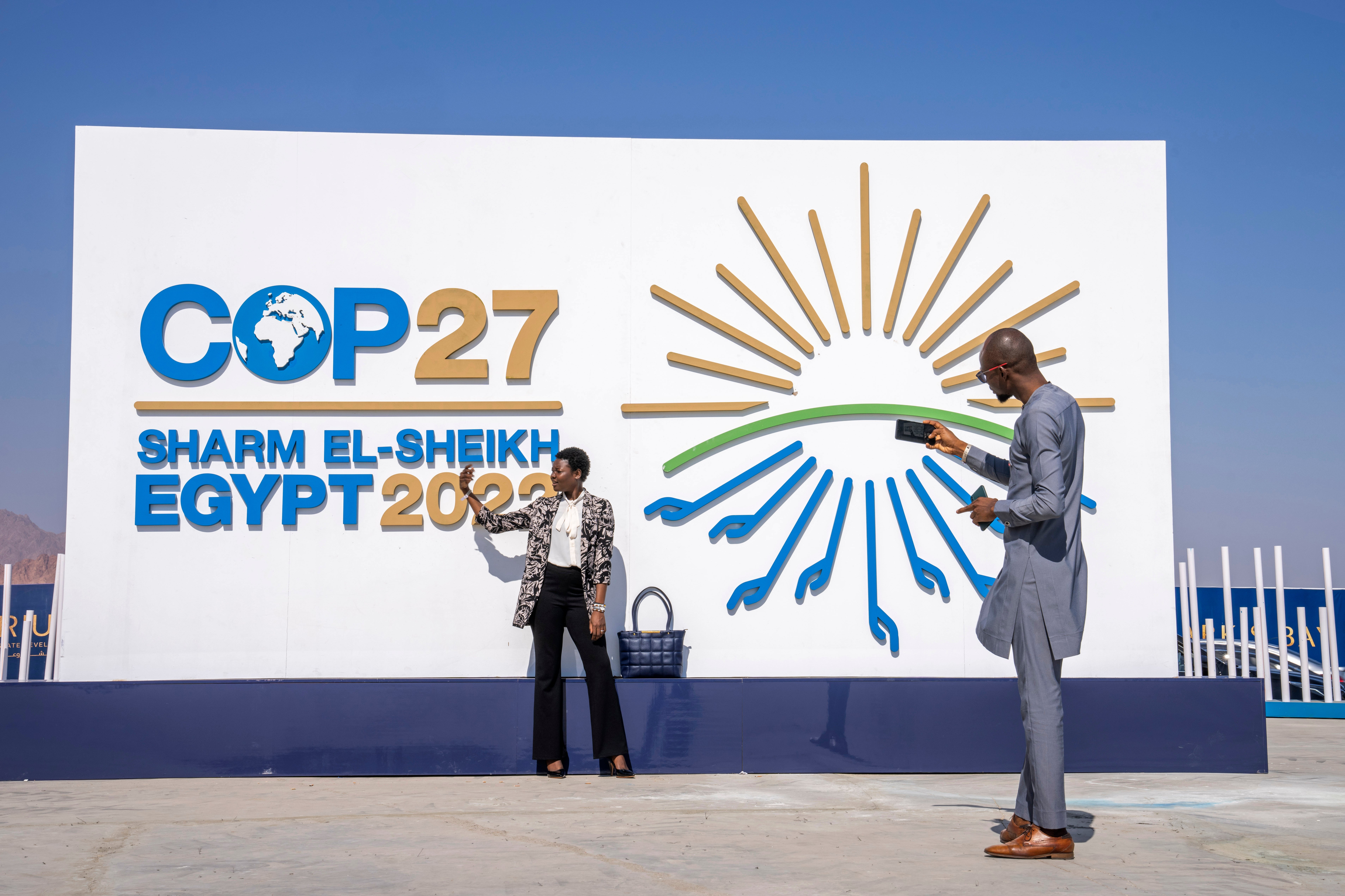 Chadians pose for a photograph at the entrance of the Cop27