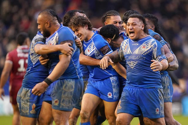 Samoa’s Josh Papali’i celebrates with his teammates after beating Tonga, during the Rugby League World Cup quarter final match at the Halliwell Jones Stadium, Warrington. Picture date: Sunday November 6, 2022.